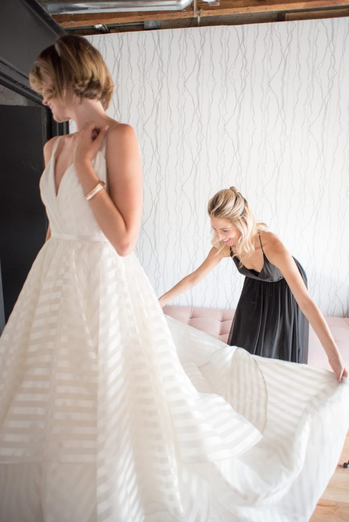 Mikkel Paige Photography photo of Dobbin St Brooklyn wedding. Planning and coordination by Color Pop Events with a striped white Hayley Paige gown.