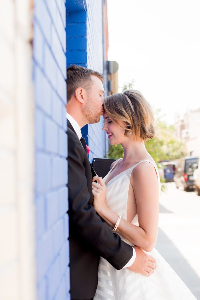 Mikkel Paige Photography photo of Dobbin St Brooklyn wedding. Planning and coordination by Color Pop Events. White striped gown by Hayley Paige.