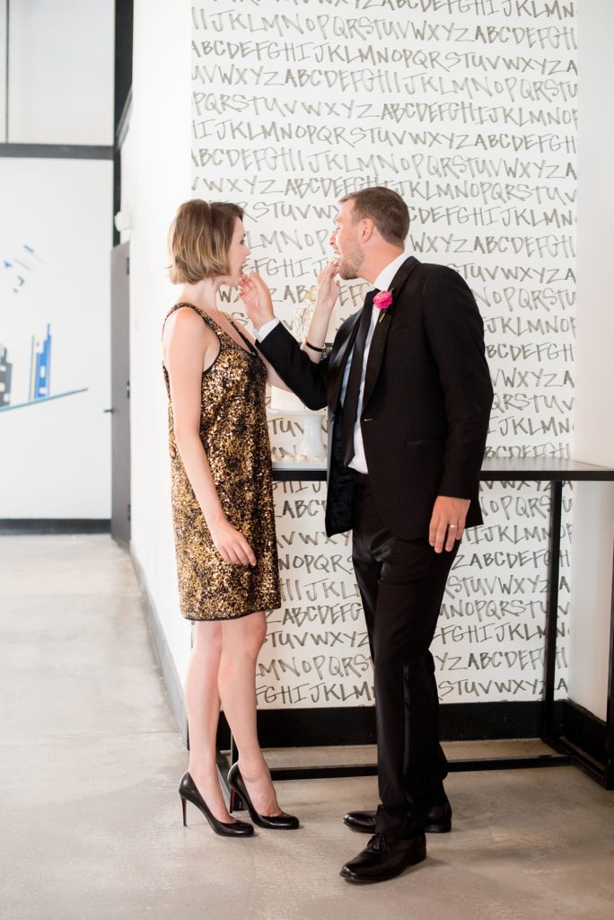 Mikkel Paige Photography photo of Dobbin St Brooklyn wedding. Planning and coordination by Color Pop Events. Colorful navy, gold and silver splatter painted dessert by Nine Cakes with a geometric topper.