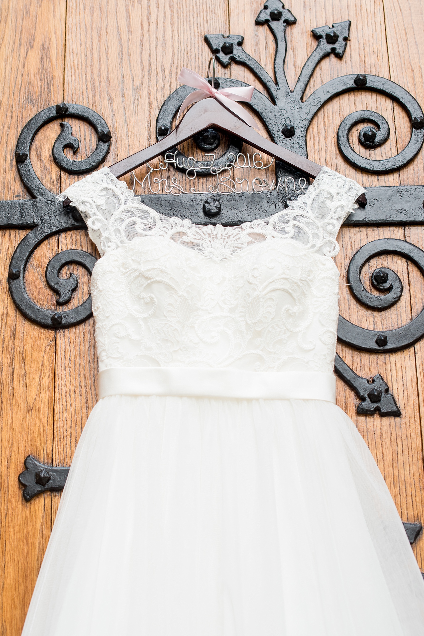 Mikkel Paige Photography photo of a Duke Chapel wedding in Durham, North Carolina with lace-cap sleeve bridal gown image.