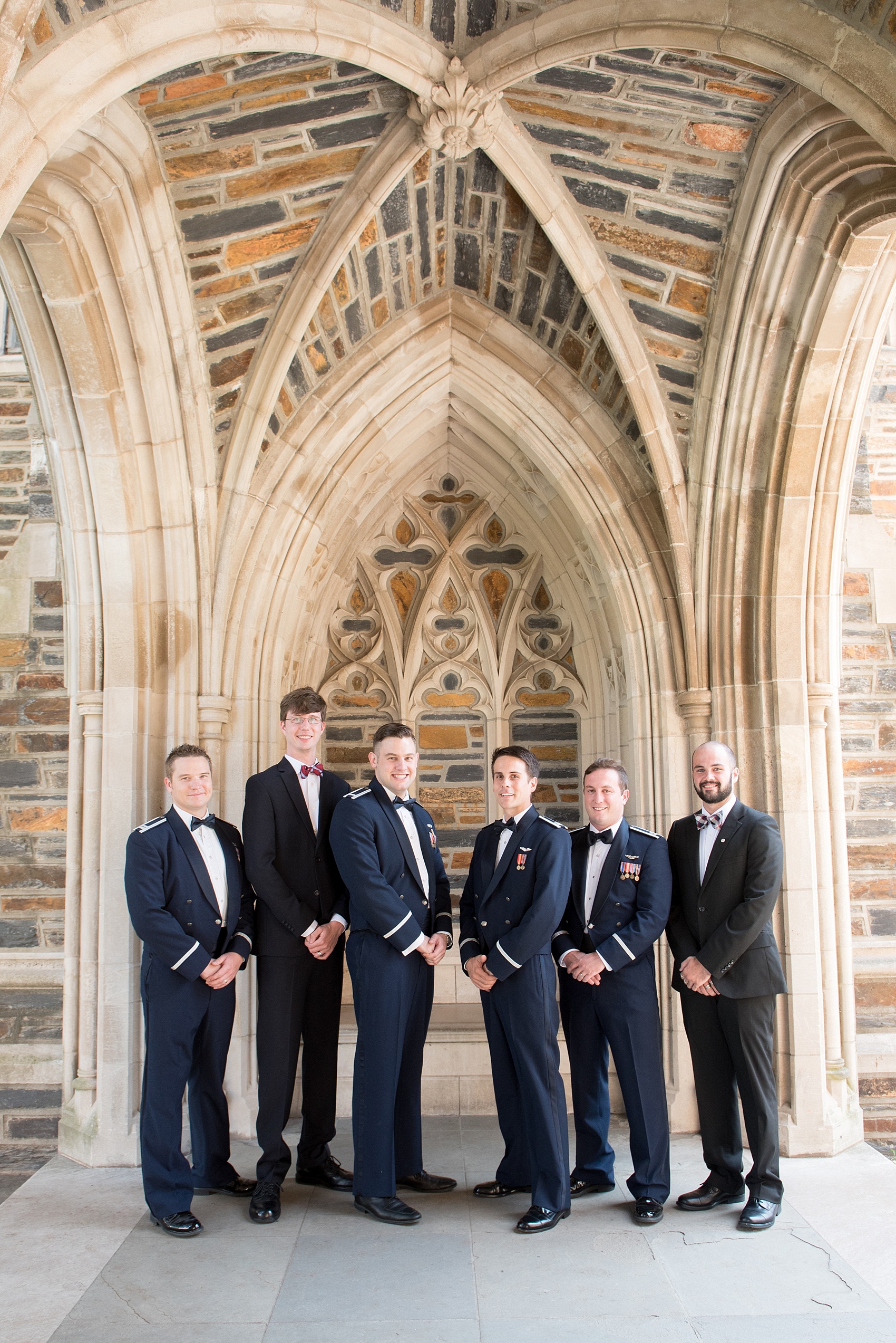 Mikkel Paige Photography photo of a Duke Chapel wedding in Durham, North Carolina. The groom and his groomsmen in Air Force uniforms under the gothic arches of the iconic church.