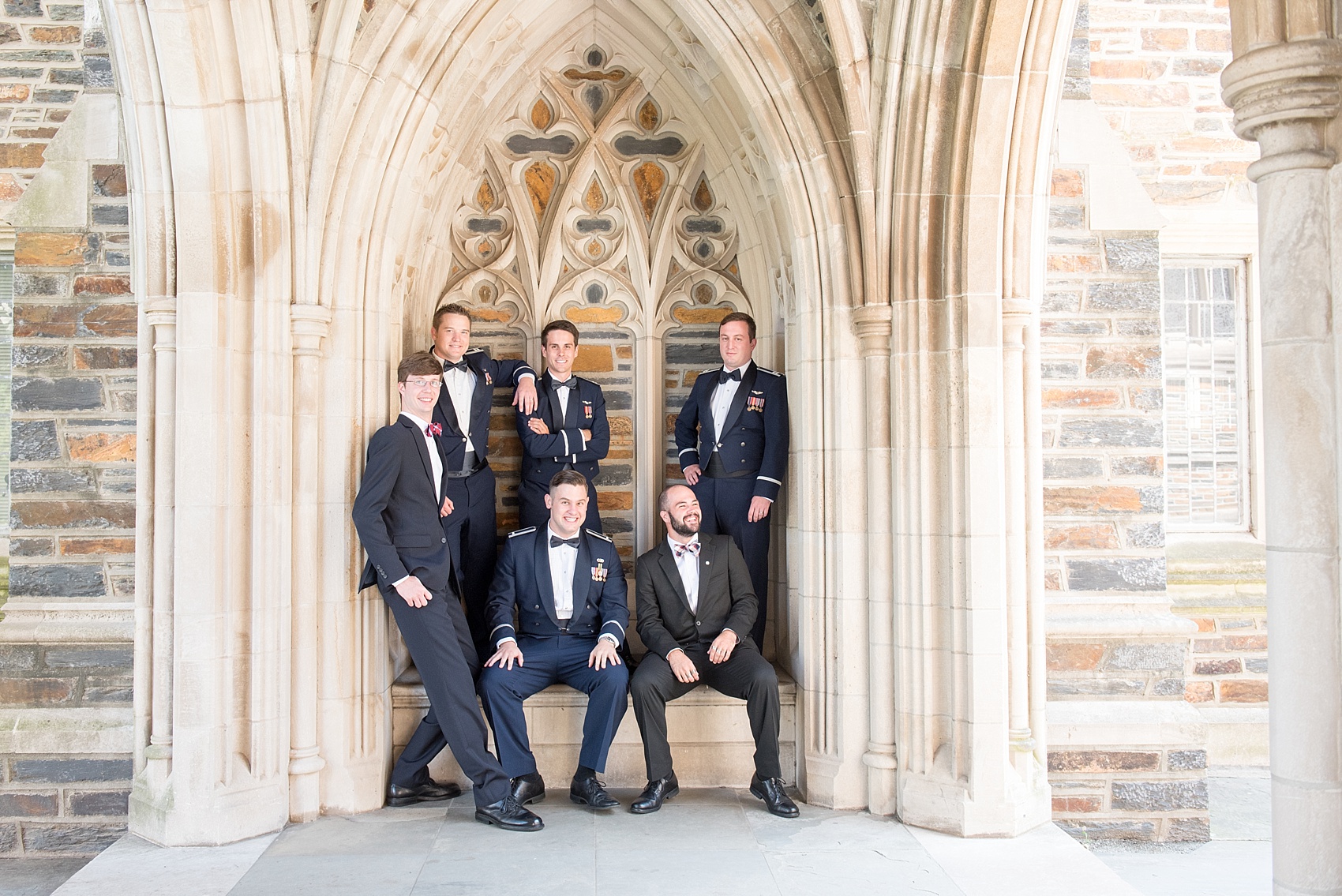 Mikkel Paige Photography photo of a Duke Chapel wedding in Durham, North Carolina. The groom and his groomsmen in Air Force uniforms under the gothic arches of the iconic church.