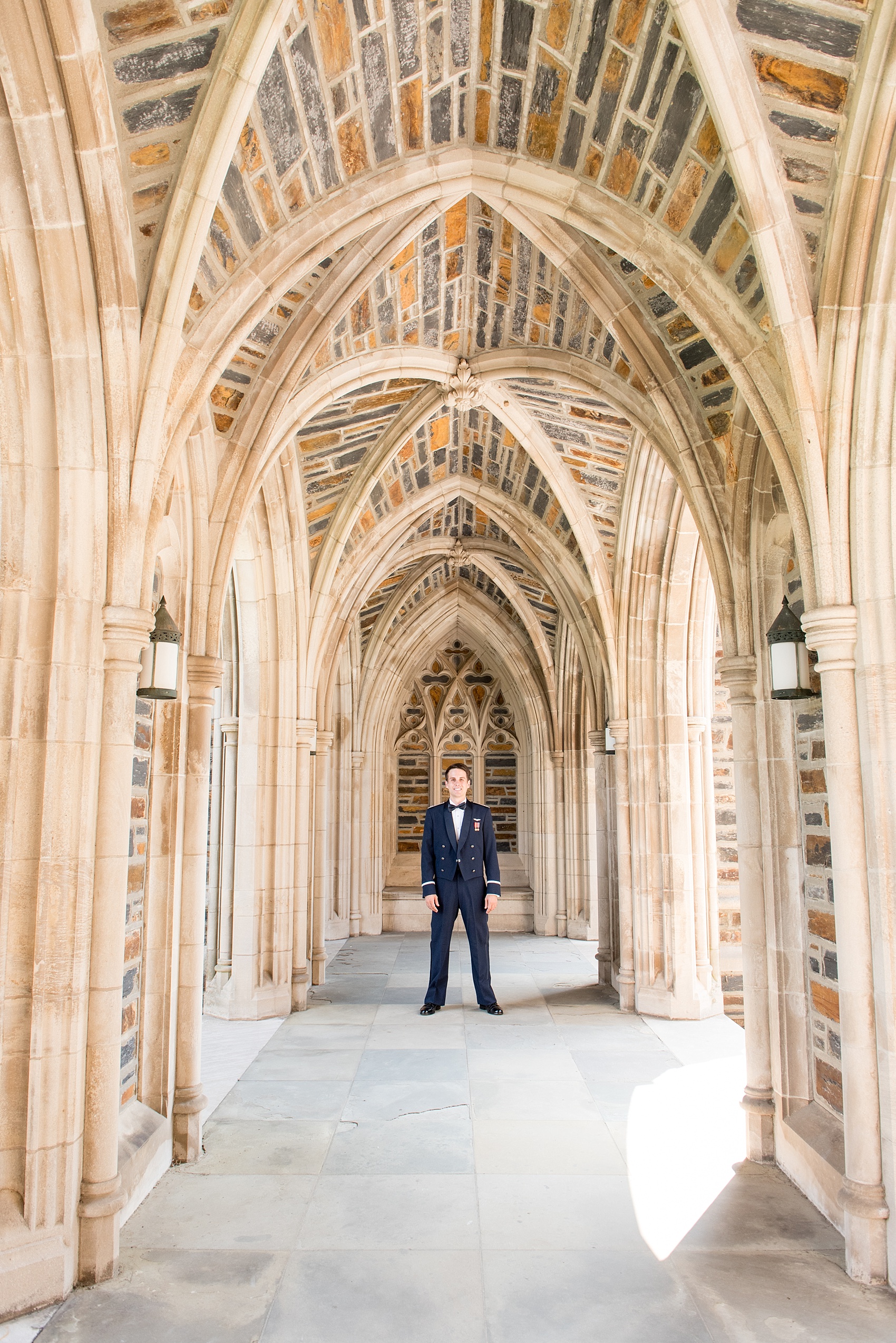 Mikkel Paige Photography photo of a Duke Chapel wedding in Durham, North Carolina. The groom wore his navy blue Air Force uniform for his iconic gothic church ceremony.