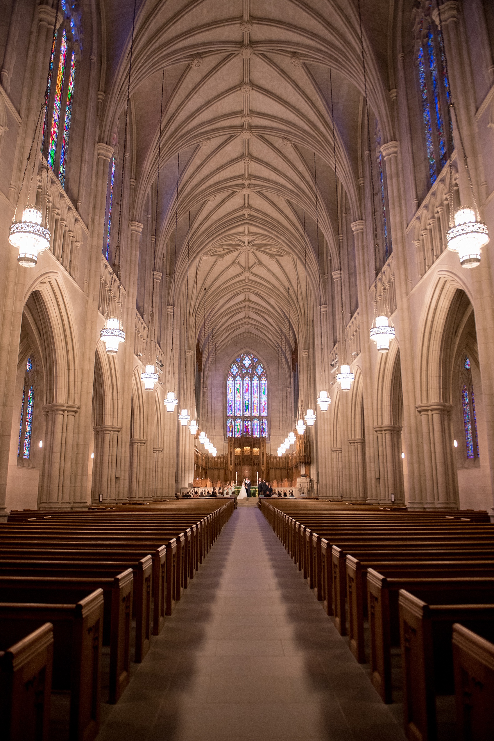 Mikkel Paige Photography photo of a Duke Chapel wedding in Durham, North Carolina. The bride and groom exchanged vows under gothic arches of the iconic church.