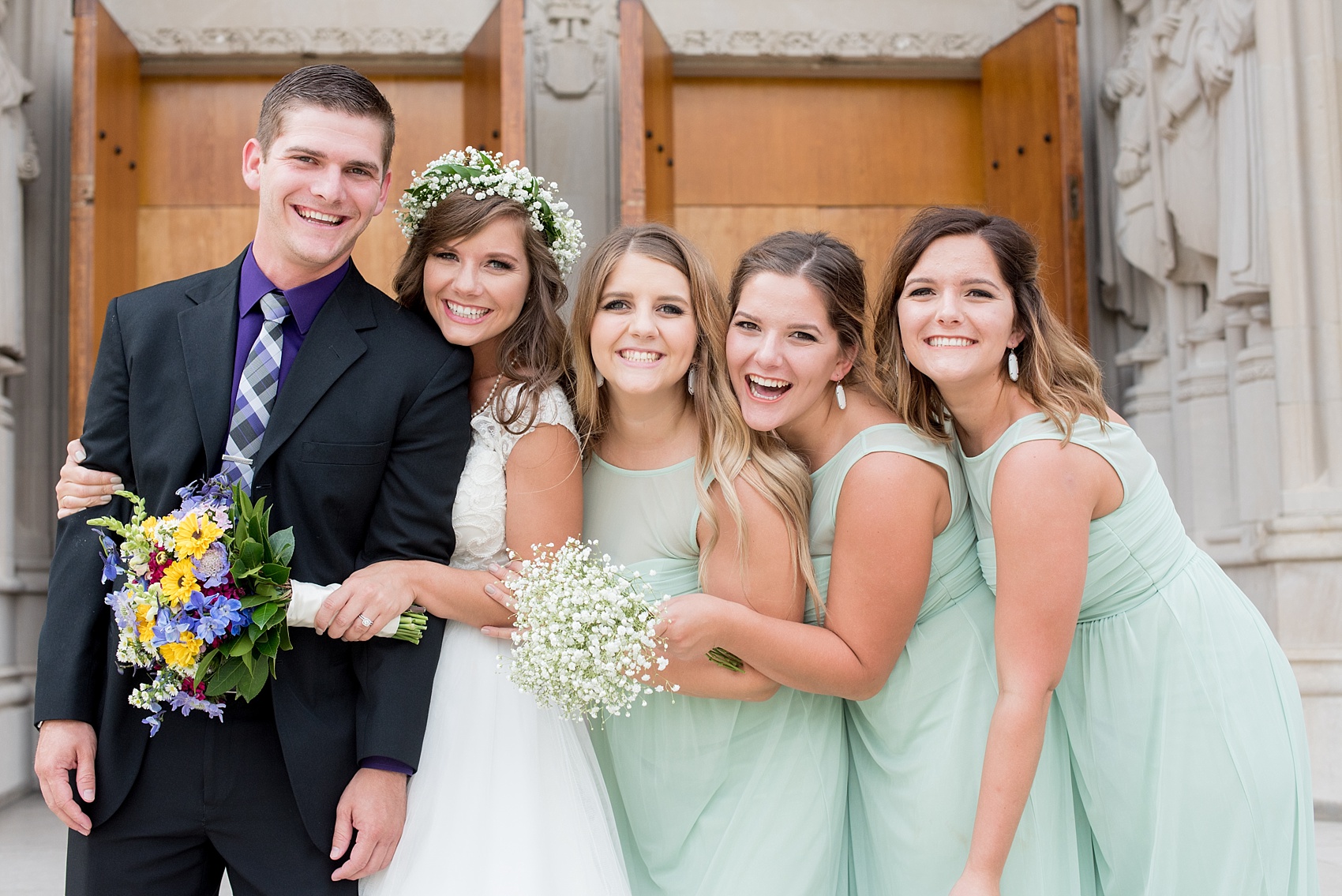 Mikkel Paige Photography photo of a Duke Chapel wedding in Durham, North Carolina. The bride and her siblings in front of the iconic gothic church.