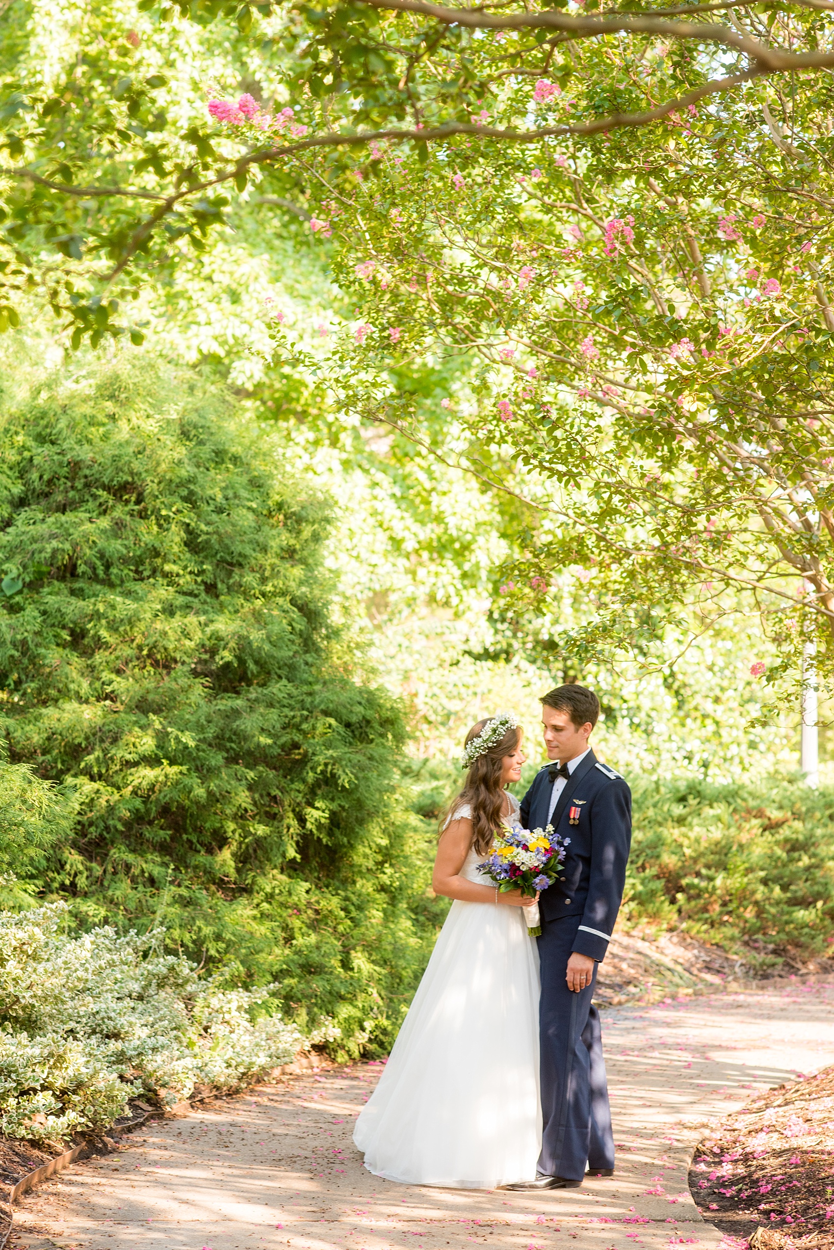 Mikkel Paige Photography photo of a Duke Chapel wedding in Durham, North Carolina. The bride in her Baby's Breath floral crown and groom in his navy blue Air Force uniform.