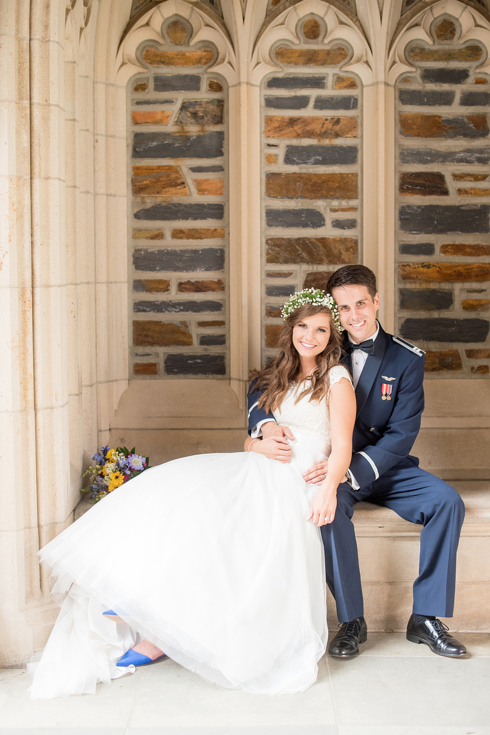 Mikkel Paige Photography photo of a Duke Chapel wedding in Durham, North Carolina. The bride in her Baby's Breath floral crown and groom in his navy blue Air Force uniform.