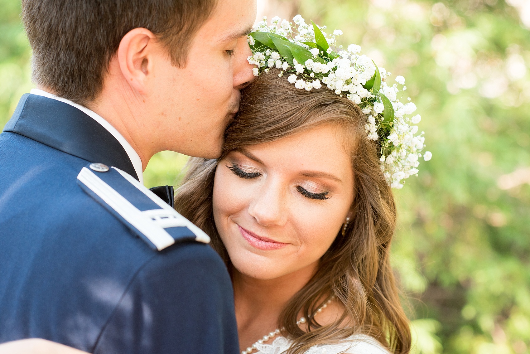 Mikkel Paige Photography photo of a Duke Chapel wedding in Durham, North Carolina. The bride in her Baby's Breath floral crown and groom in his navy blue Air Force uniform.