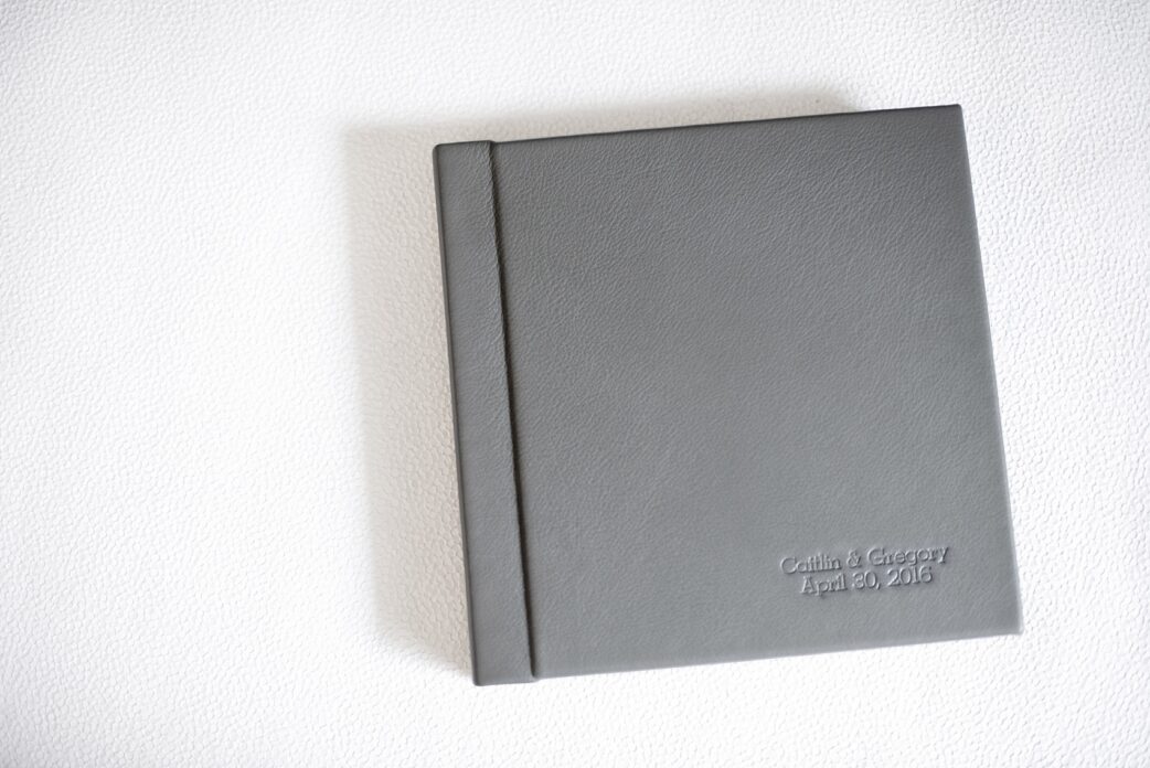 Mikkel Paige Photography grey leather wedding album book from The Harbor Club at Prime on Long Island.