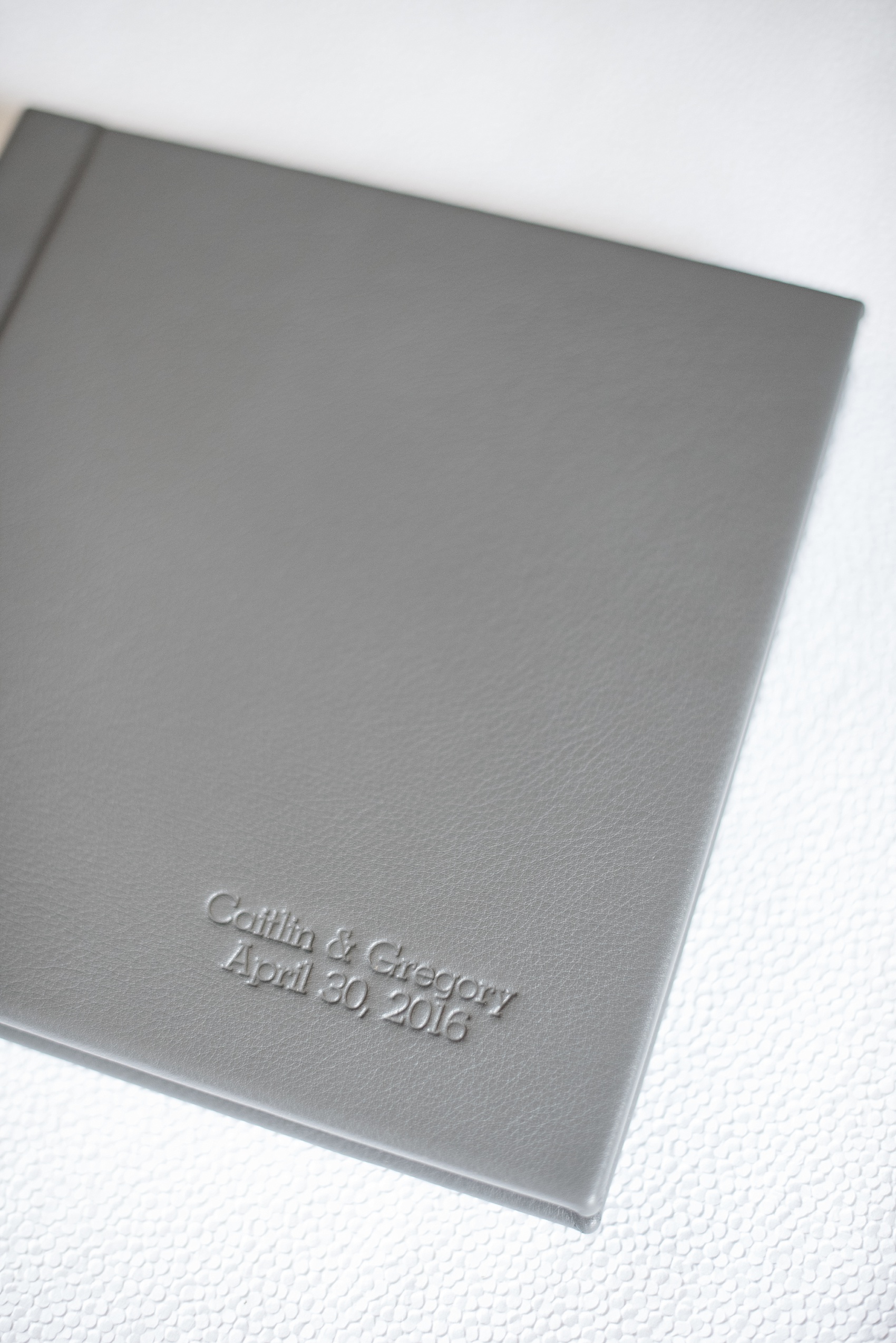 Mikkel Paige Photography grey leather wedding album book from The Harbor Club at Prime on Long Island.