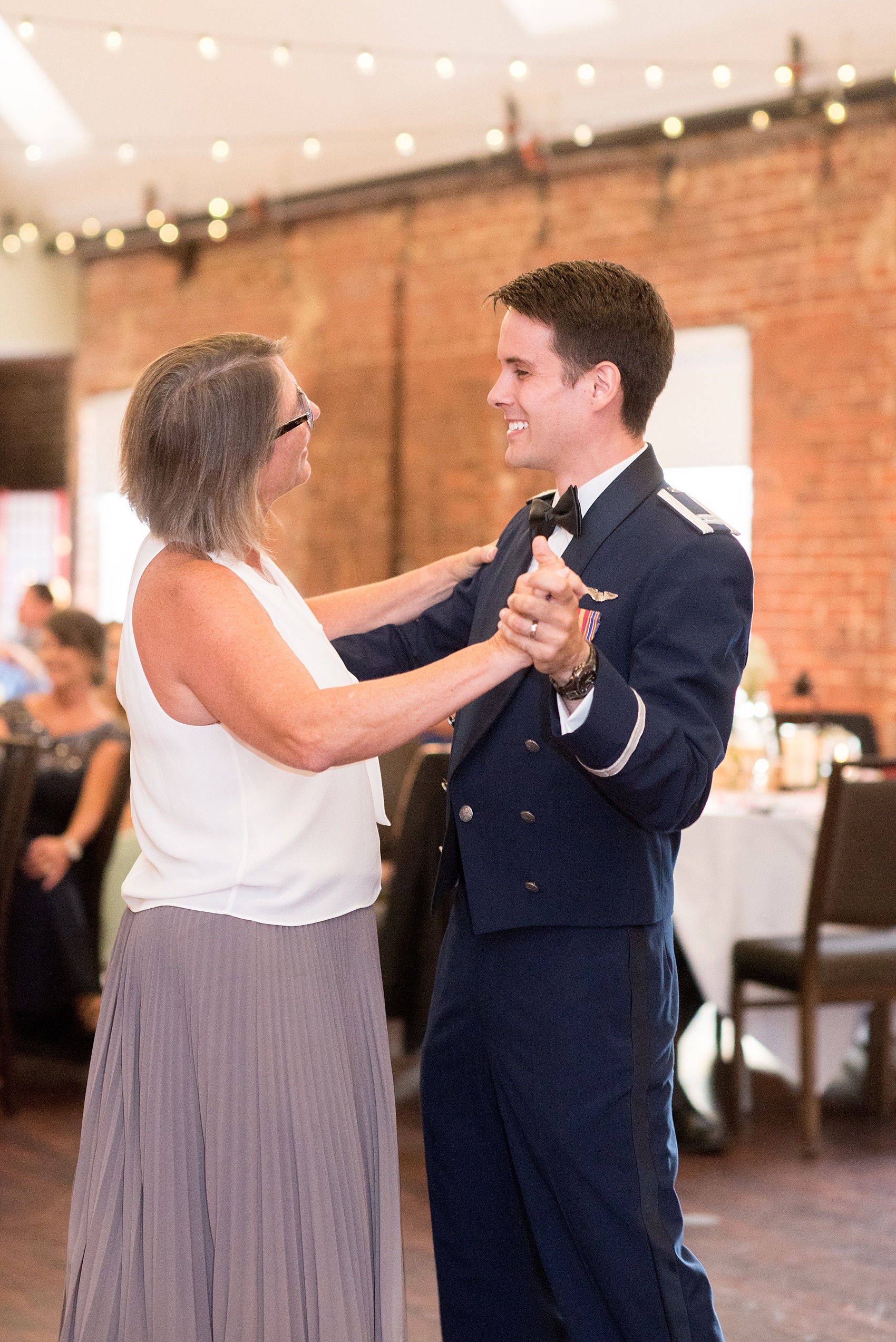 Mikkel Paige Photography photo of a Top of the Hill reception in Chapel Hill, NC. The groom dances with his mother.