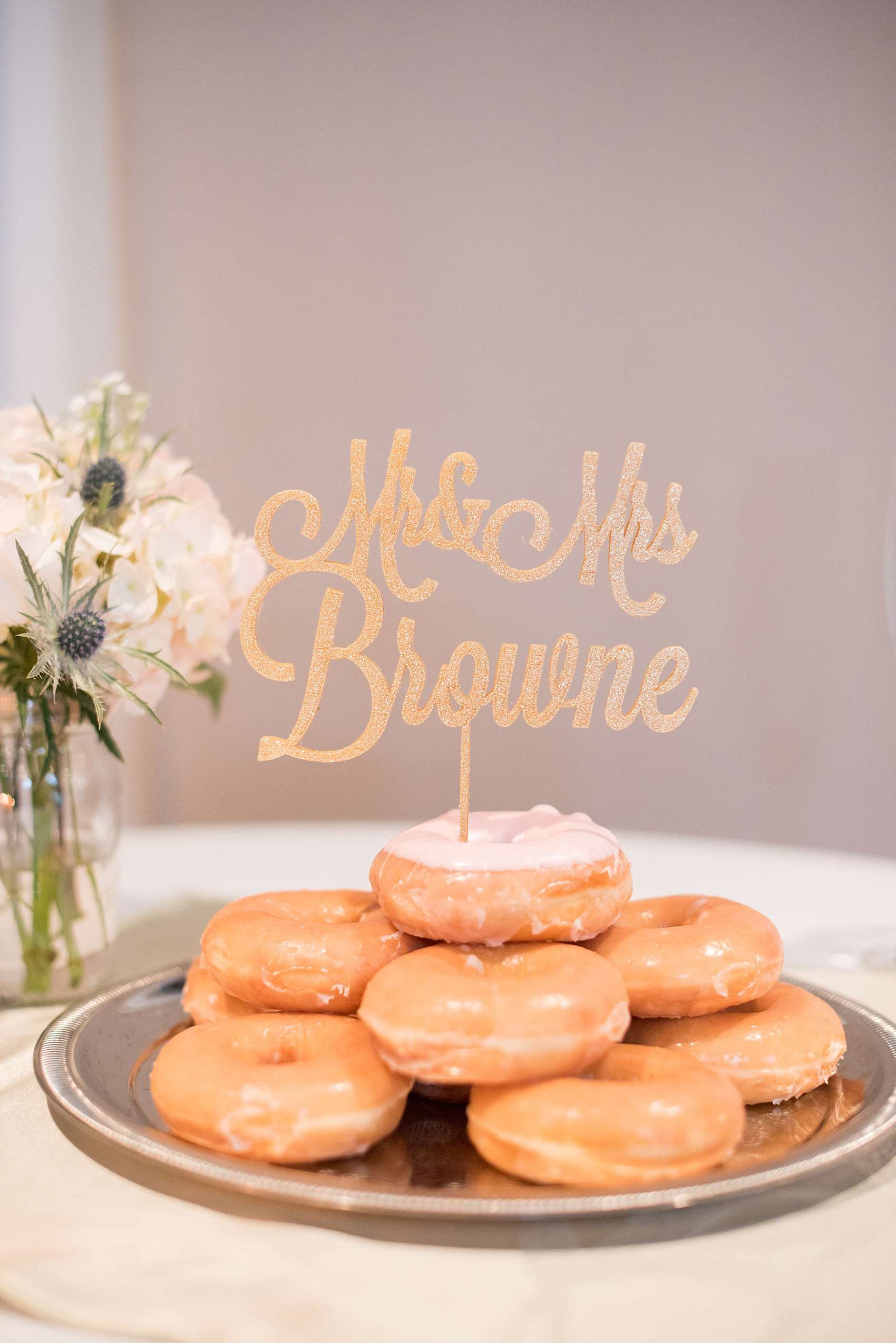 Mikkel Paige Photography photo of a Top of the Hill reception in Chapel Hill, NC. Image of the donut cake and laser cut monogram topper.