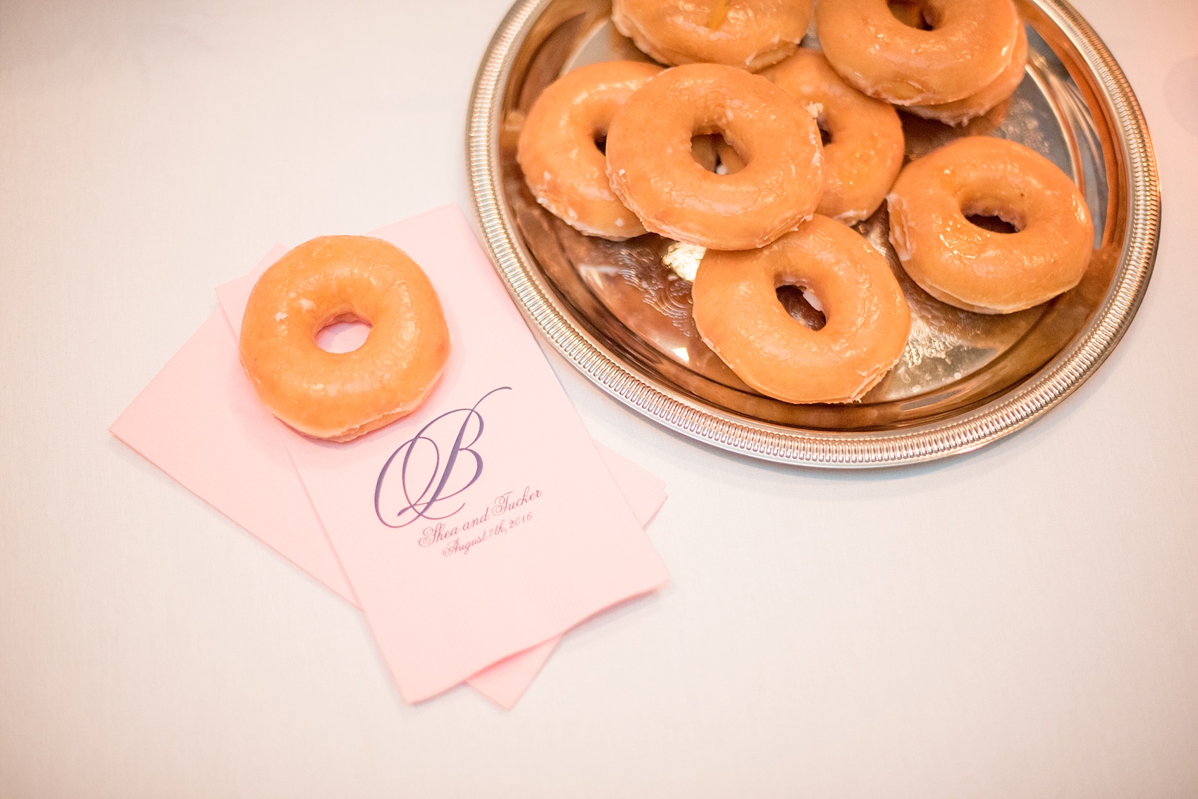 Mikkel Paige Photography photo of a Top of the Hill reception in Chapel Hill, NC. Image of the donut dessert and custom napkins.