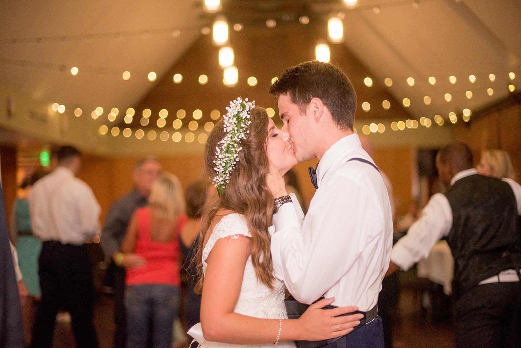 Mikkel Paige Photography photo of a Top of the Hill reception in Chapel Hill, NC with the bride and groom sharing a dance floor final kiss.