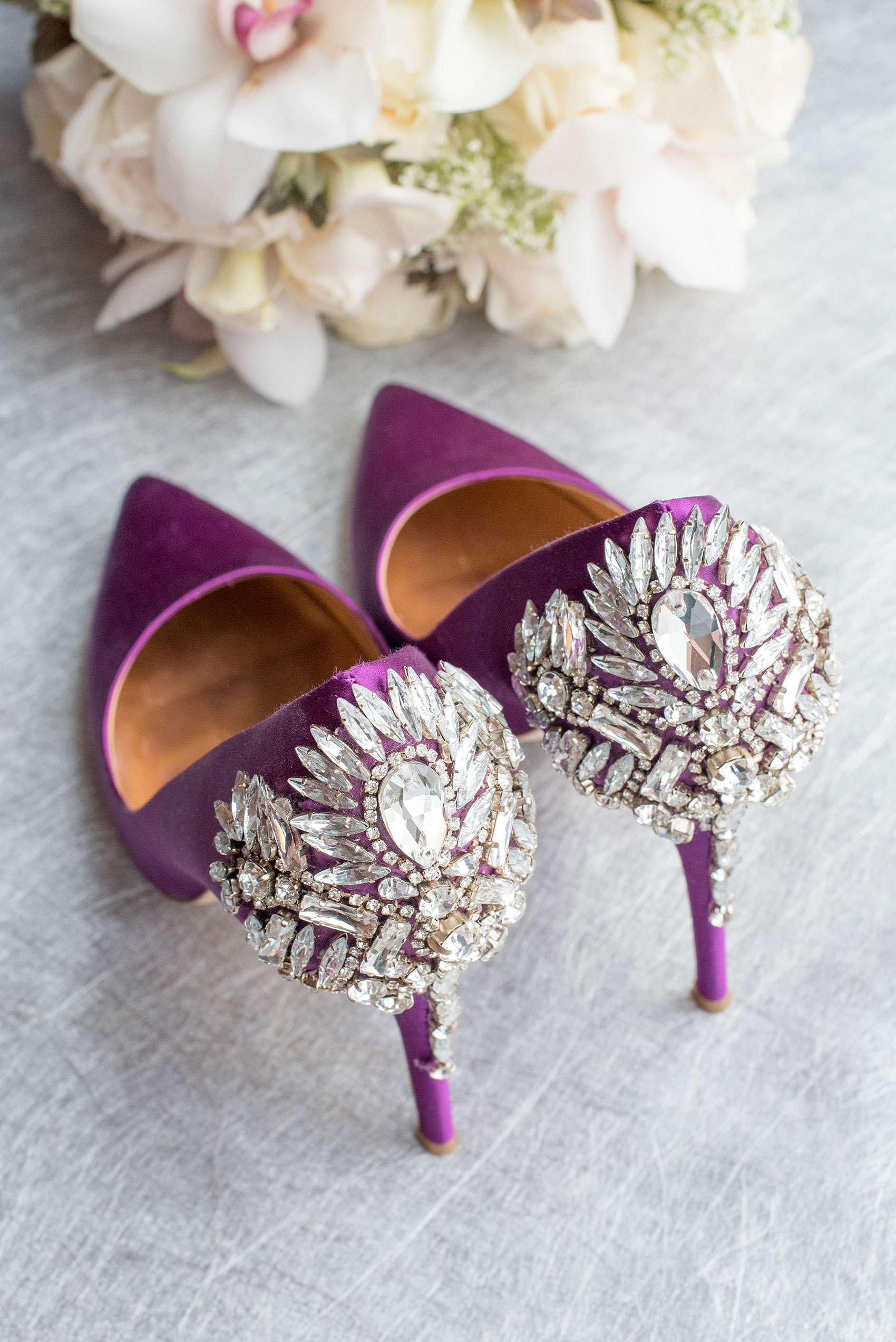 Mikkel Paige Photography photos of a NYC wedding at Tribeca Rooftop. The bride wore purple Badgley Mischka heels with jewels on them.