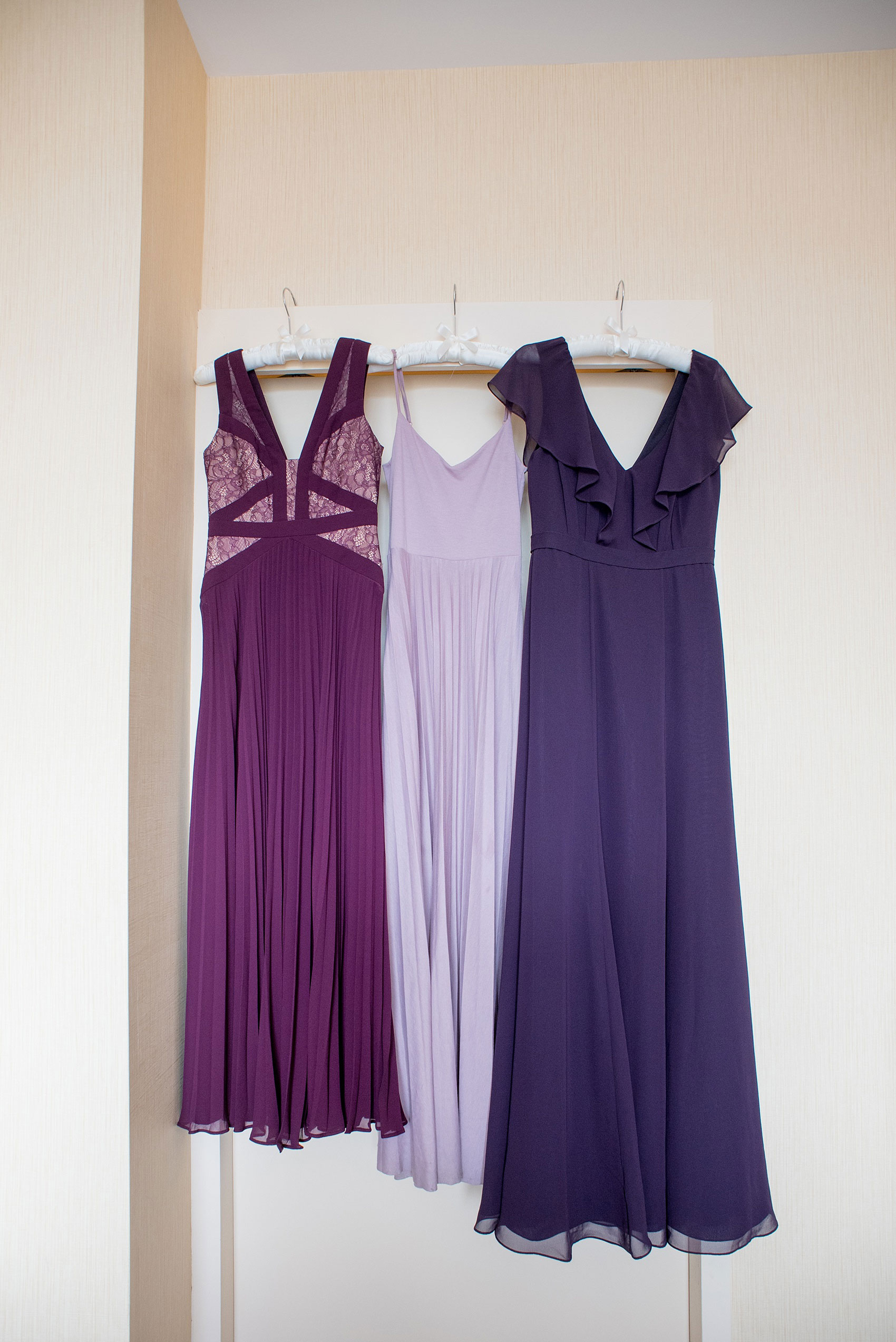 Mikkel Paige Photography photos of a NYC wedding at Tribeca Rooftop. The bridesmaids wore three different shades of purple.