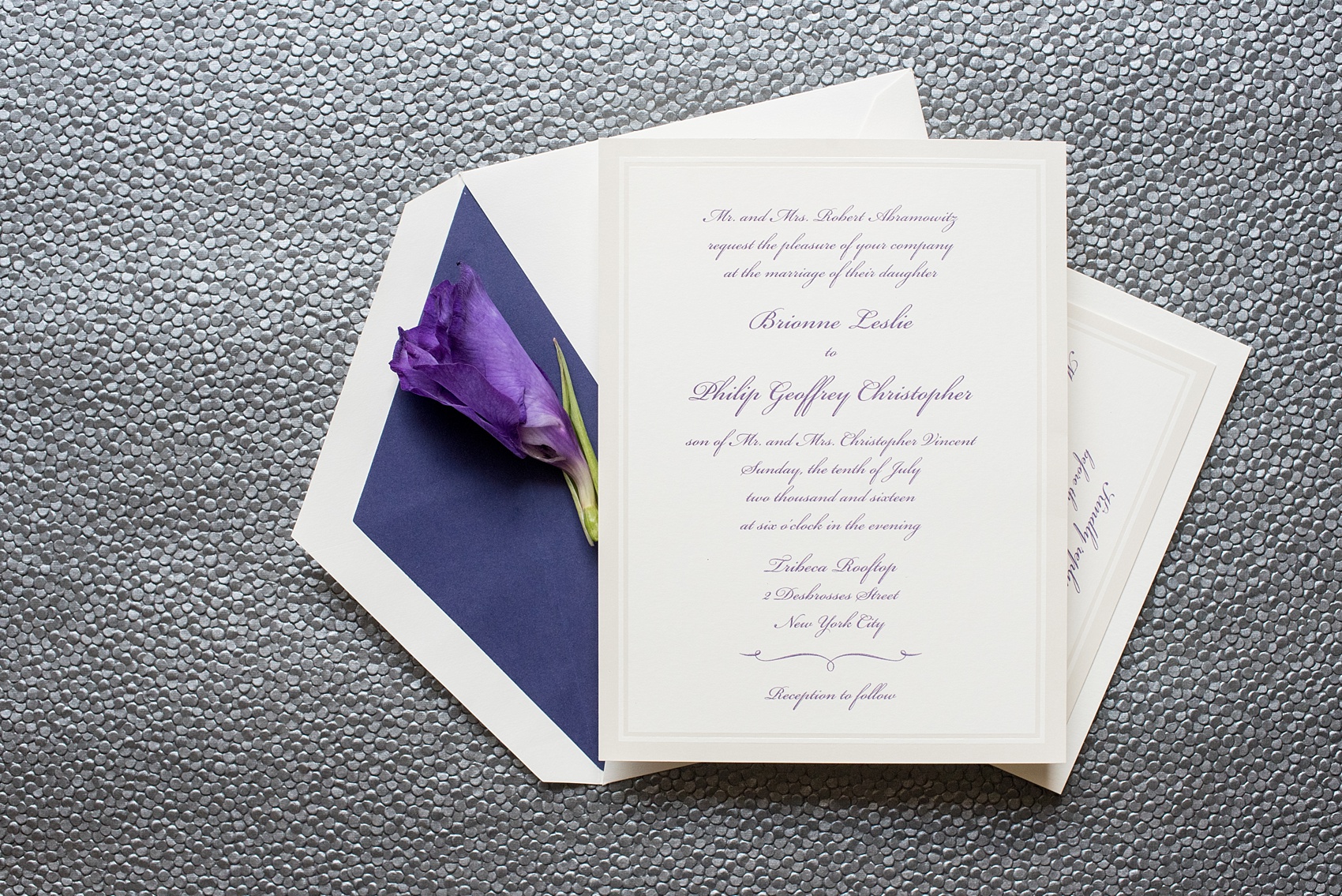 Mikkel Paige Photography photos of a NYC wedding at Tribeca Rooftop. Purple and off white classy wedding invitation and plane ticket save the date.