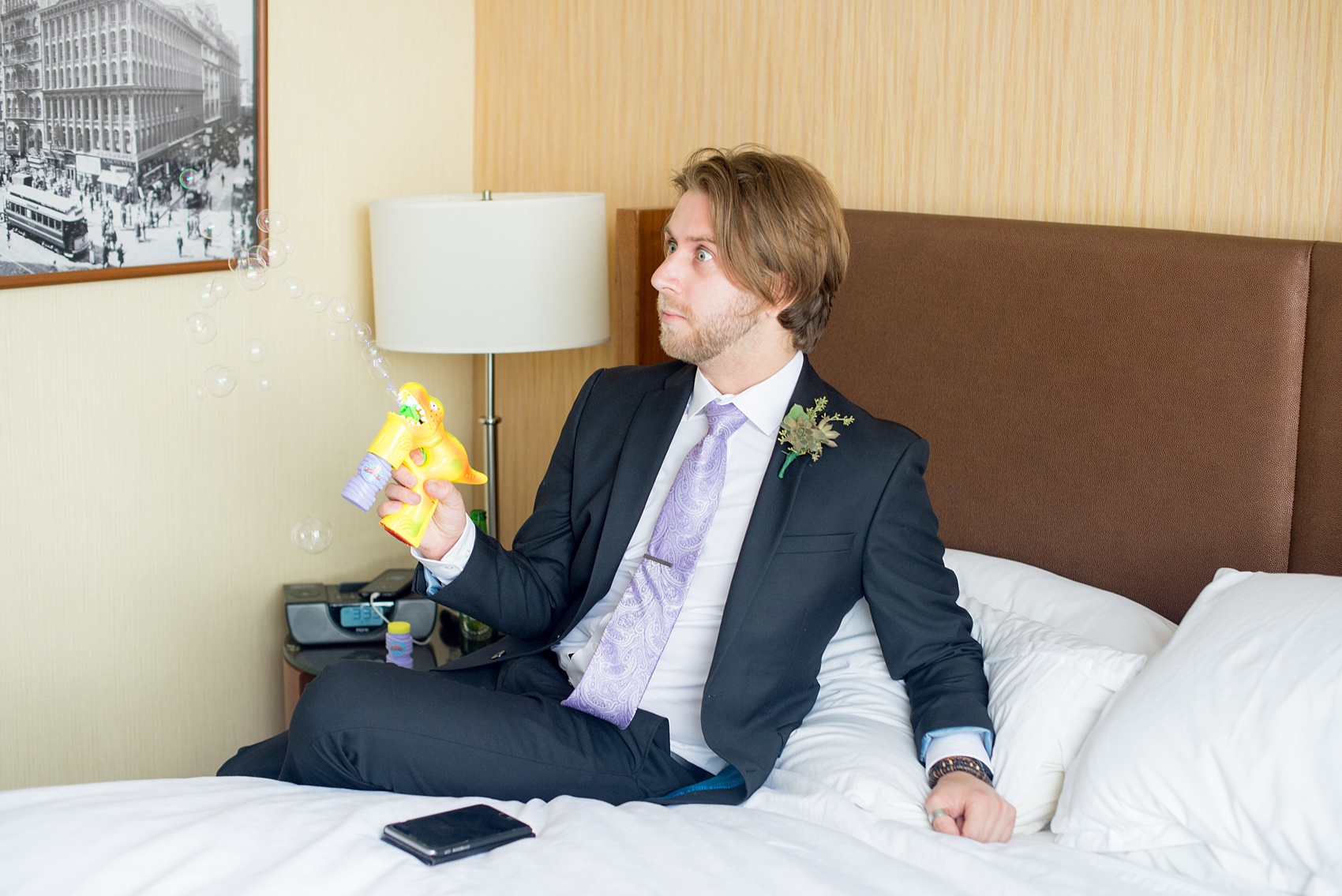 Mikkel Paige Photography photos of a NYC wedding at Tribeca Rooftop. The groomsmen get ready for the day with bubble dinosaurs!