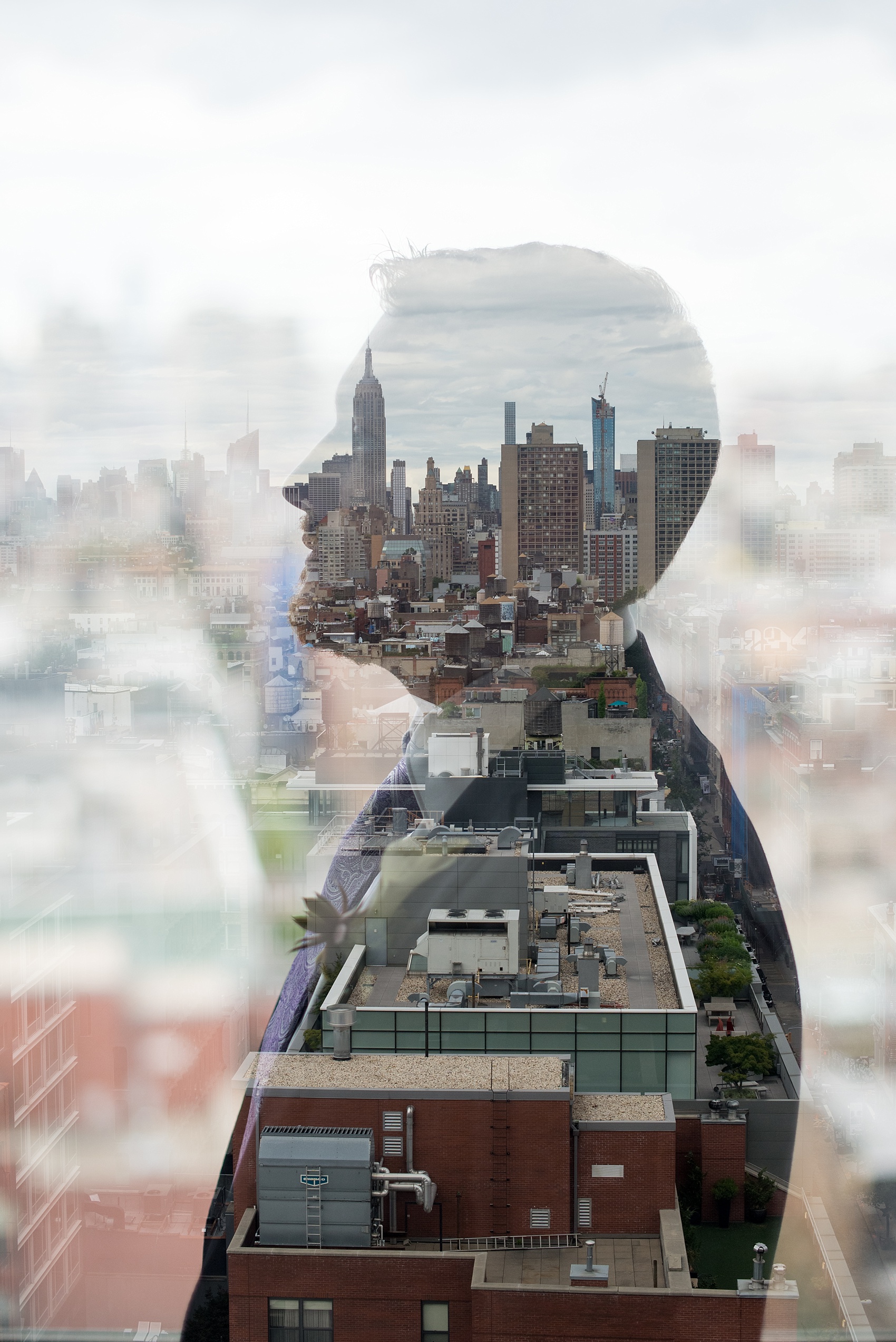 Mikkel Paige Photography photos of a NYC wedding at Tribeca Rooftop. Groom double exposure image with his silhouette and Manhattan skyline.