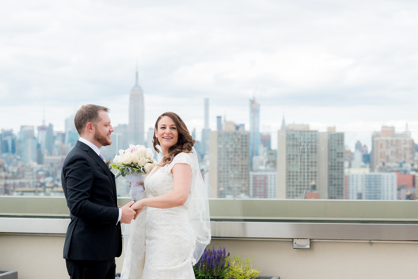 Mikkel Paige Photography photos of a NYC wedding at Tribeca Rooftop. First look with the Manhattan Skyline.