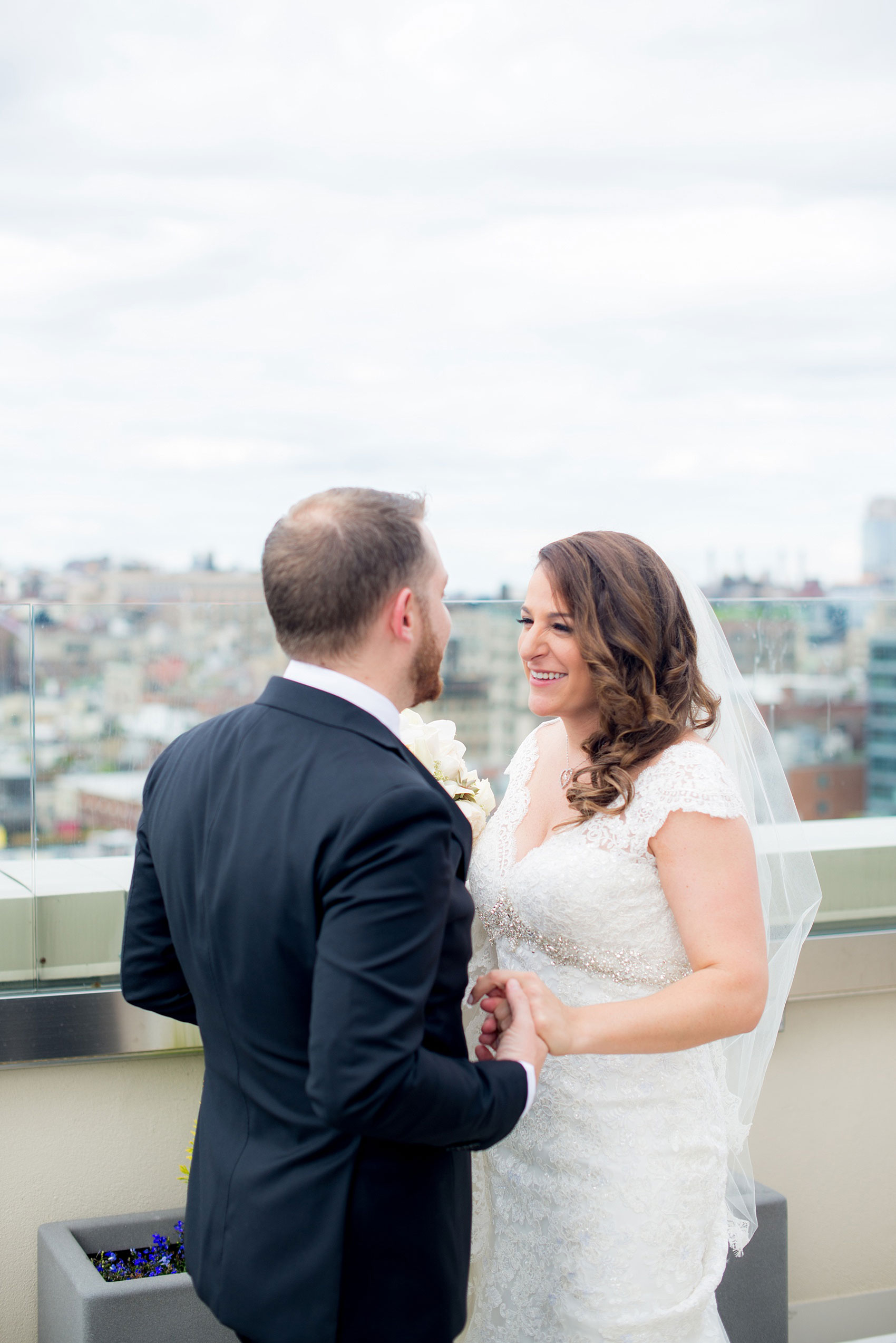 Mikkel Paige Photography photos of a NYC wedding at Tribeca Rooftop. First look with the Manhattan Skyline.