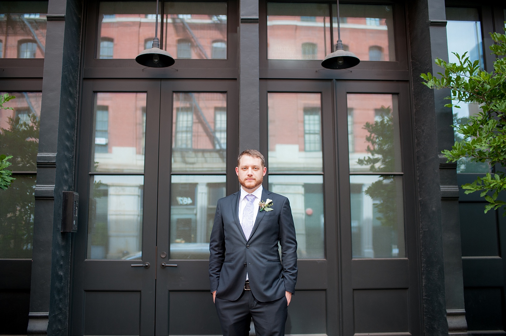 Mikkel Paige Photography photos of a NYC wedding at Tribeca Rooftop. An urban portrait of the groom in lower Manhattan.