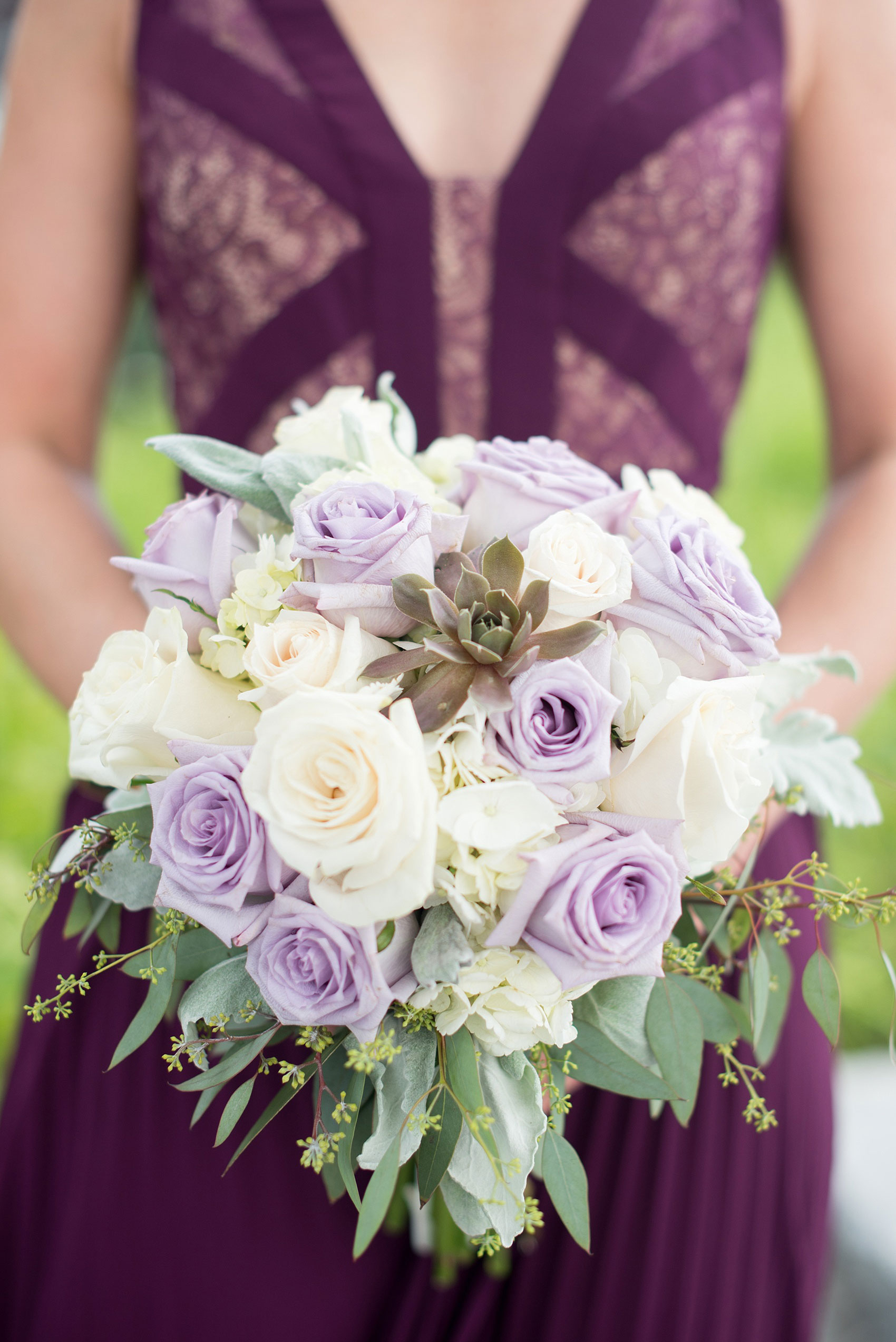 Mikkel Paige Photography photos of a NYC wedding at Tribeca Rooftop. An urban image of the wedding party in shades of mismatched purple dresses with rose and succulent bouquets.