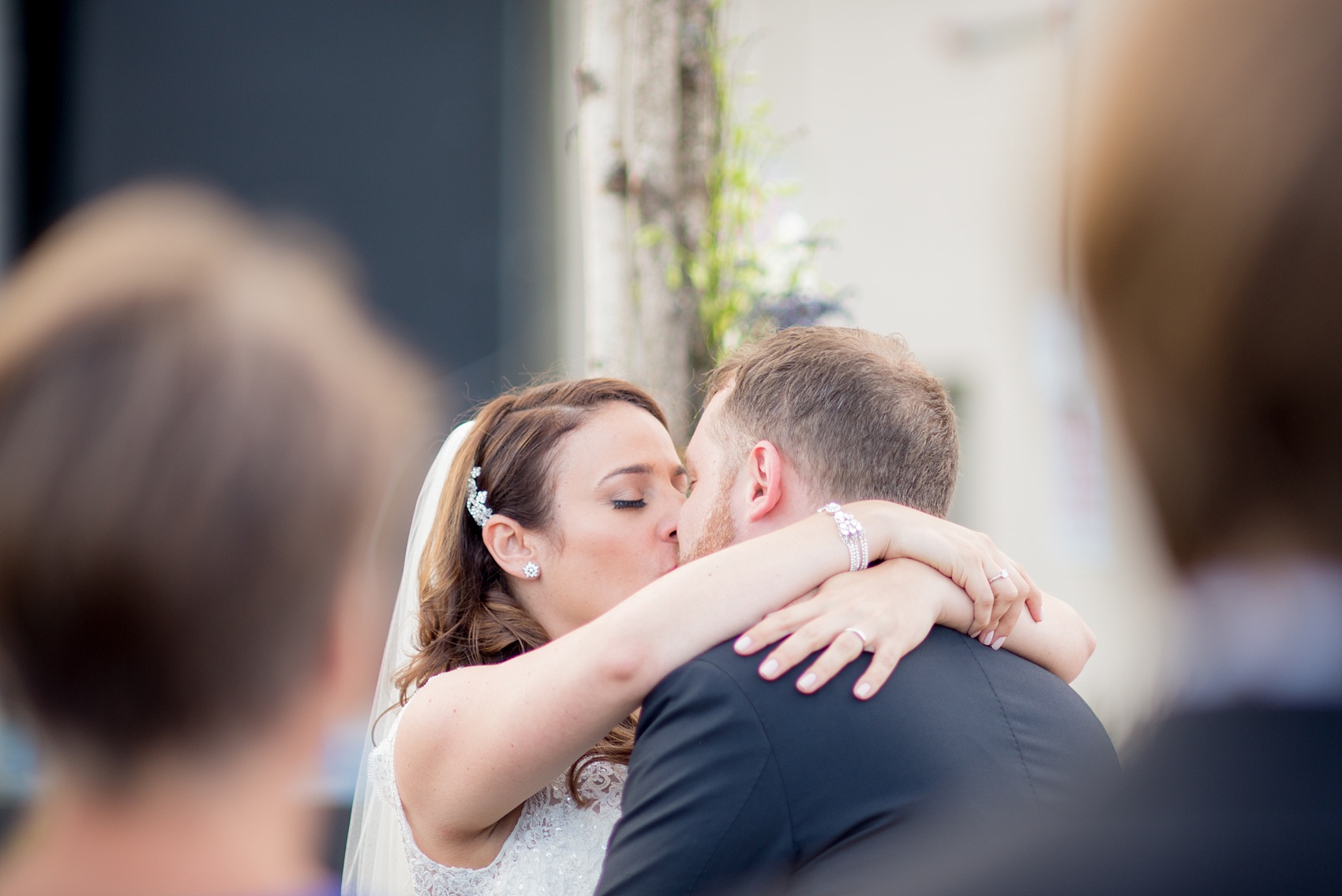 Mikkel Paige Photography photos of a NYC wedding at Tribeca Rooftop. An image of the outdoor ceremony first kiss!