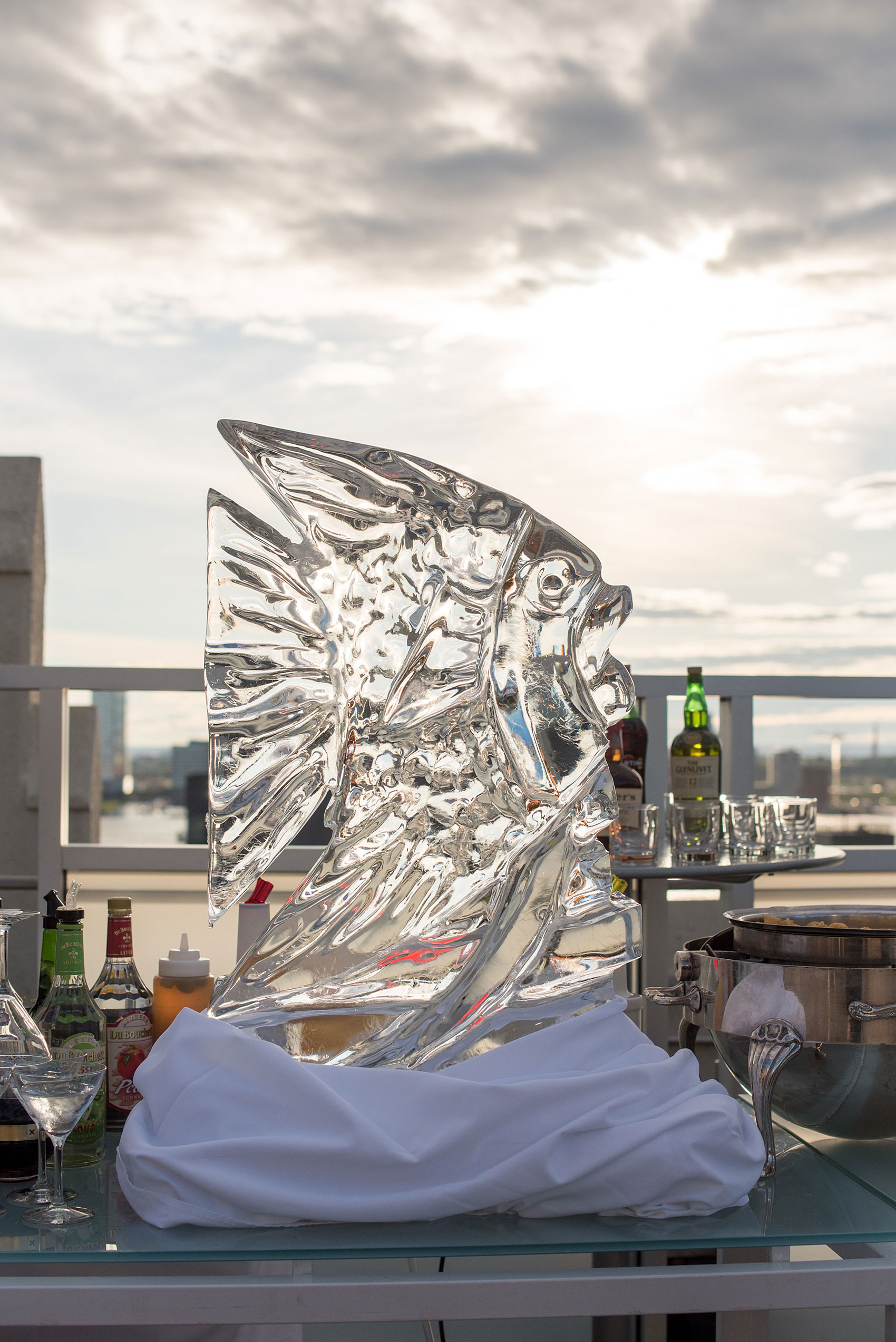 Mikkel Paige Photography photos of a NYC wedding at Tribeca Rooftop. An image of the cocktail fish ice sculpture.