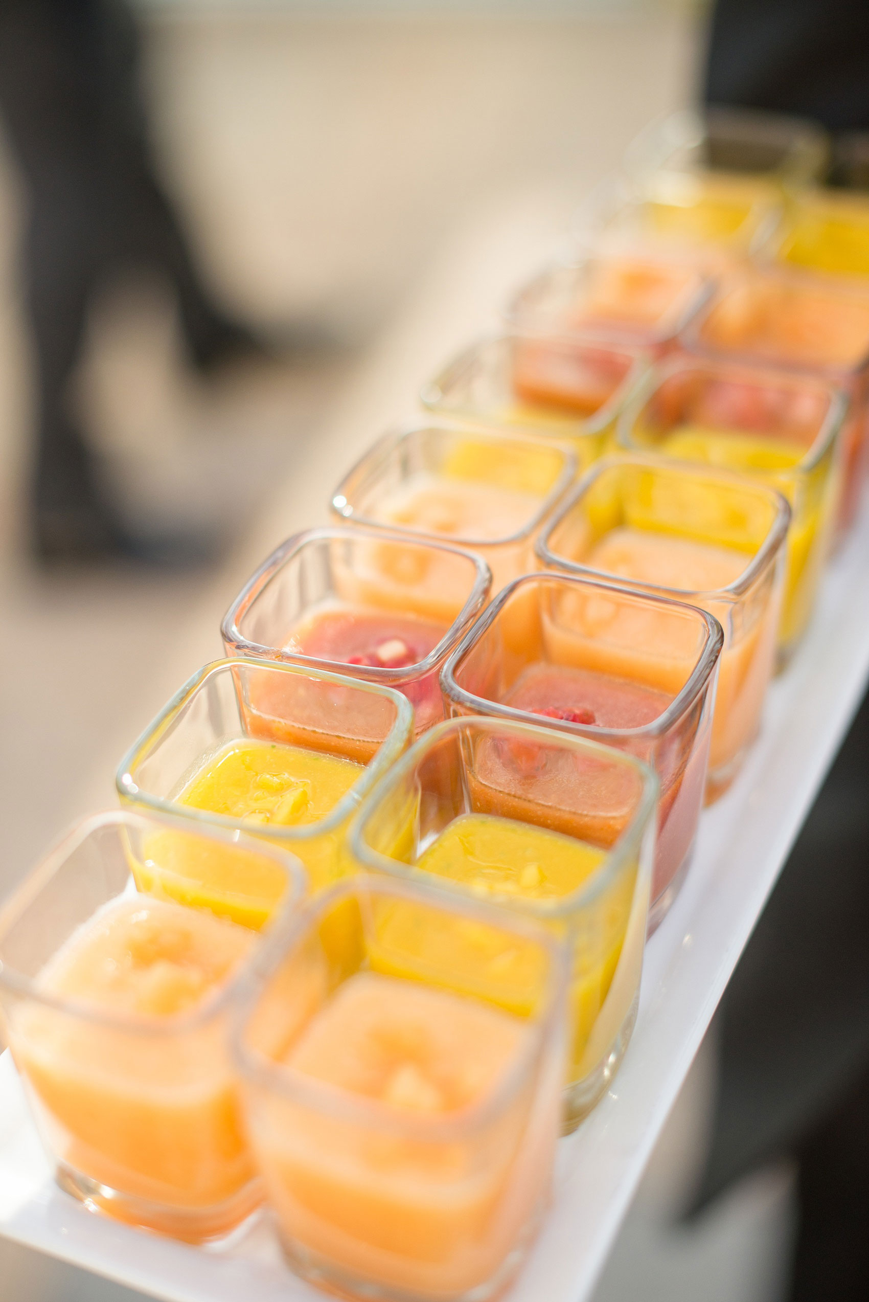 Mikkel Paige Photography photos of a NYC wedding at Tribeca Rooftop. An image of the outdoor cocktail hour with chilled soup gazpacho flavors.