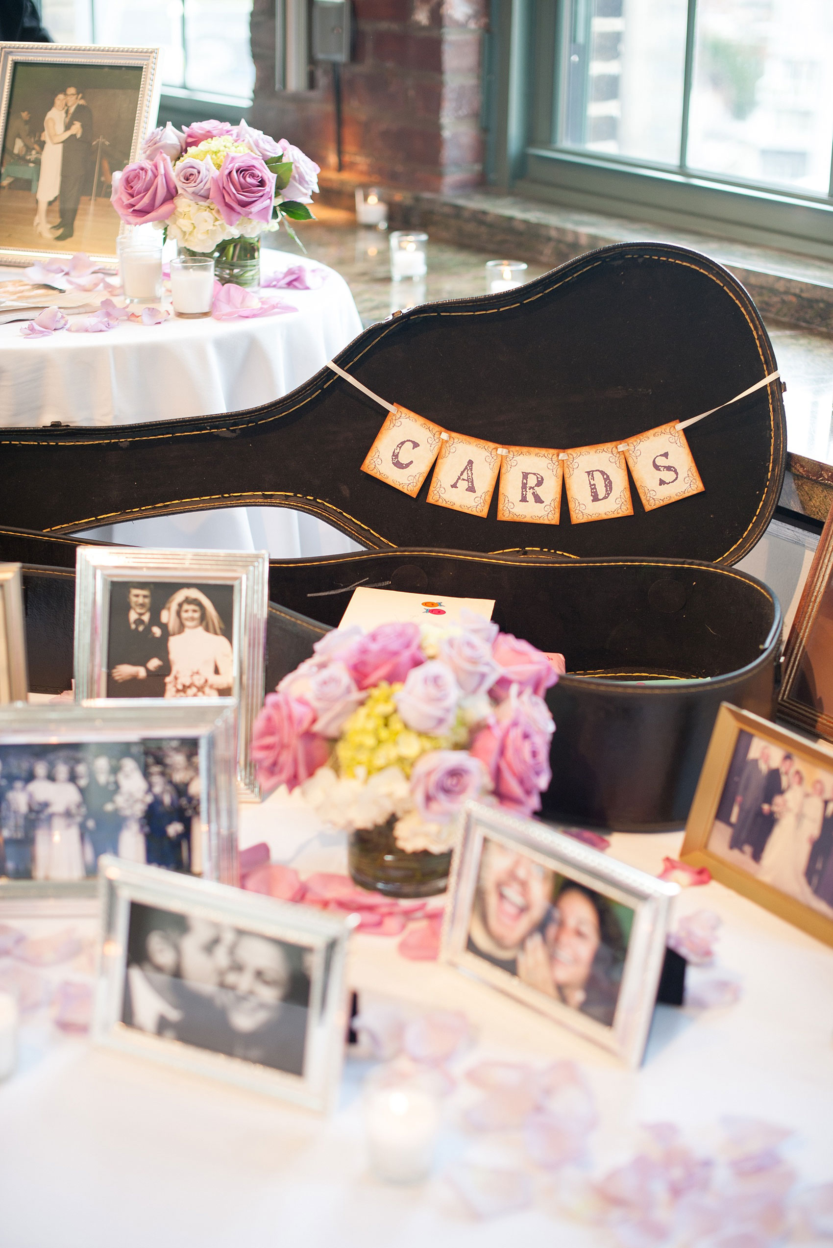 Mikkel Paige Photography photos of a NYC wedding at Tribeca Rooftop. An image of the welcome table with guitar card case.