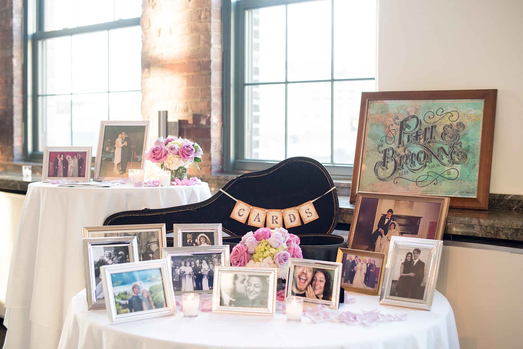 Mikkel Paige Photography photos of a NYC wedding at Tribeca Rooftop. An image of the welcome table with guitar card case.