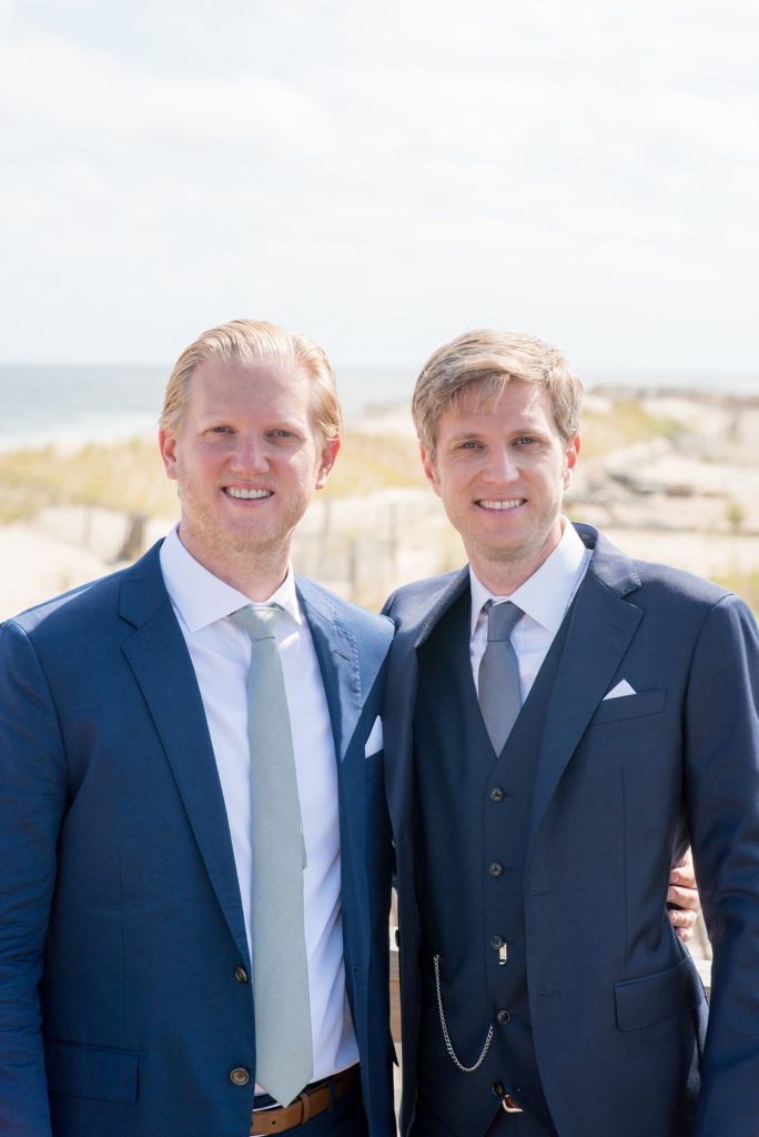 Mikkel Paige Photography photos from a Bay Head wedding in NJ. The groom and his best man posed for a photo on the beach for a nautical themed day at the yacht club.