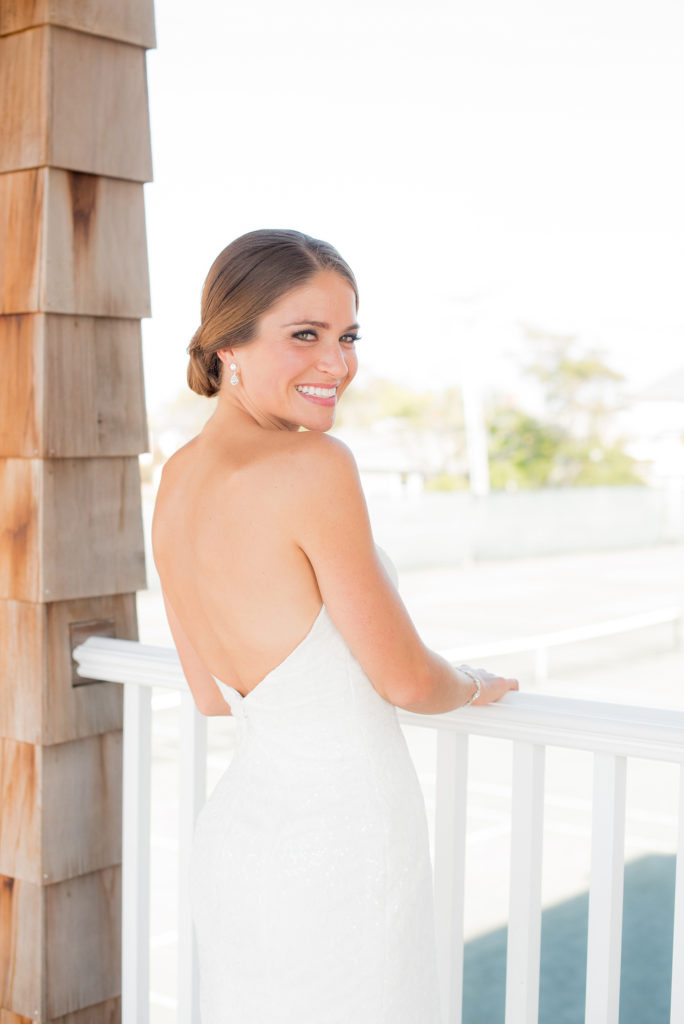 Mikkel Paige Photography photos of a Bay Head Yacht Club nautical wedding. The bride wore a low back sweetheart neckline gown.