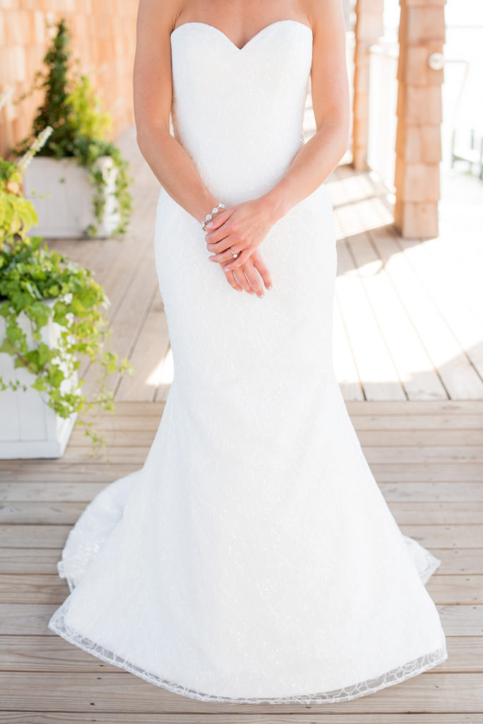 Mikkel Paige Photography photos of a Bay Head Yacht Club nautical wedding. The bride wore a white sweetheart neckline gown with lace and white sequins from Kleinfeld bridal.