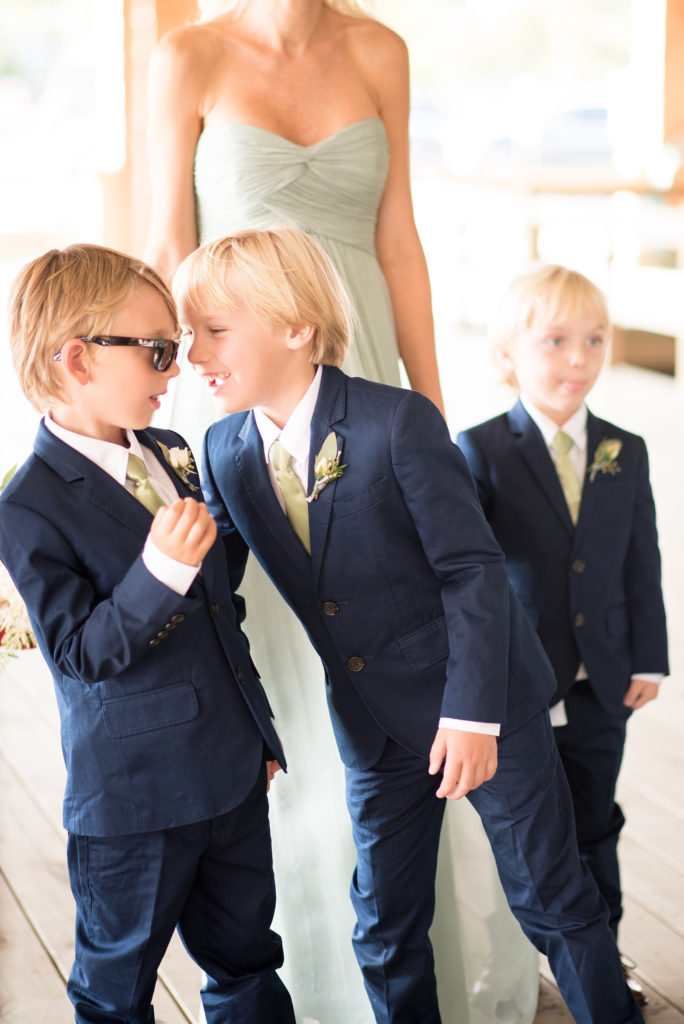 Mikkel Paige Photography photos of a Bay Head Yacht Club nautical wedding. The ring bearers wore navy blue suits with mini boutonnieres.