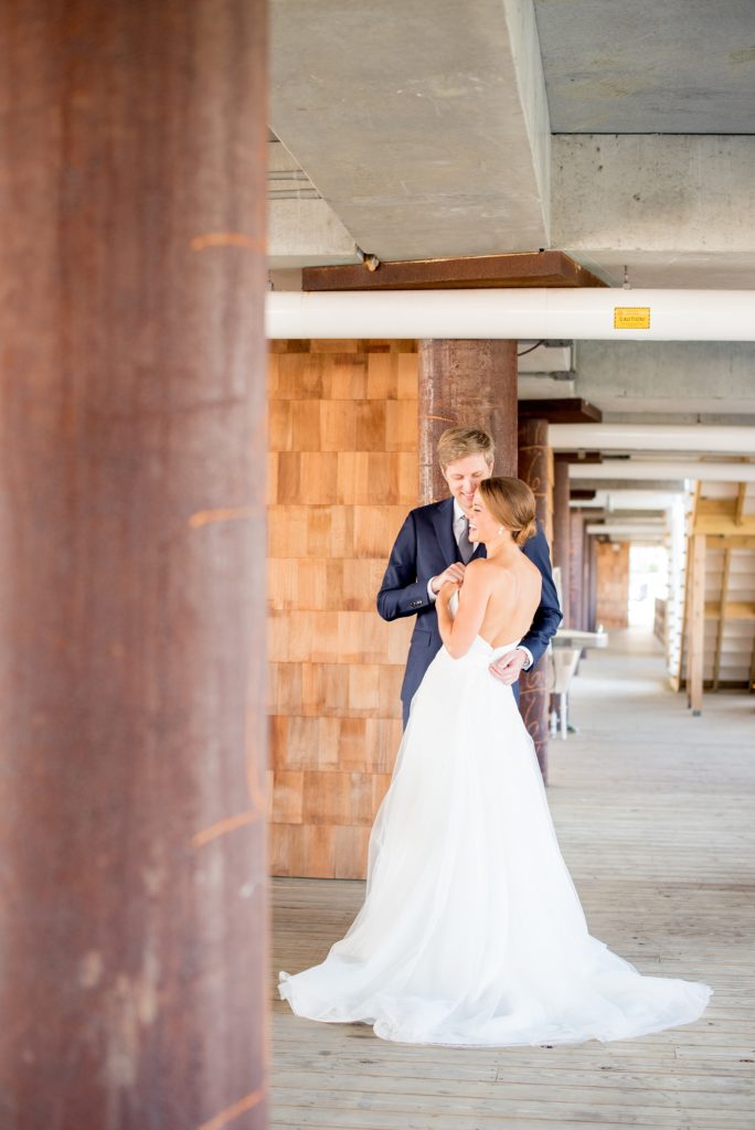 Mikkel Paige Photography photos of a Bay Head Yacht Club nautical wedding. The bride wore a white low back gown with lace and white sequins from Kleinfeld bridal.