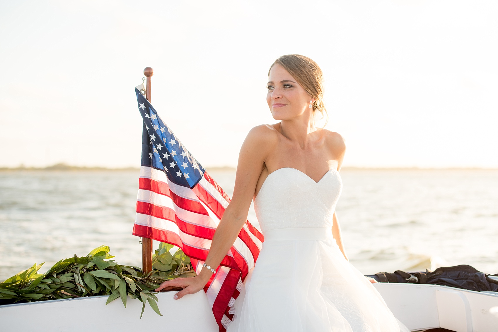 Mikkel Paige Photography picture of a Bay Head Yacht Club nautical wedding. The bride and groom took a vintage 1950's boat to their reception.