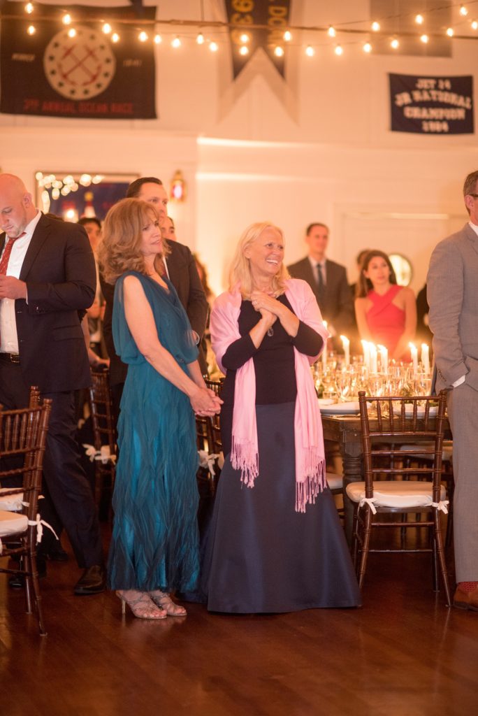 Mikkel Paige Photography picture of a Bay Head Yacht Club nautical wedding. The mothers look on as the bride and groom share their first dance.