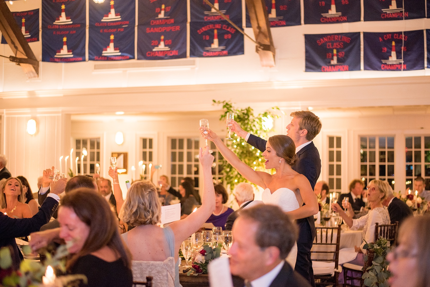 Mikkel Paige Photography reception photo of a wedding at Bay Head Yacht Club on the water in New Jersey. The bride and groom honor his Swedish heritage.