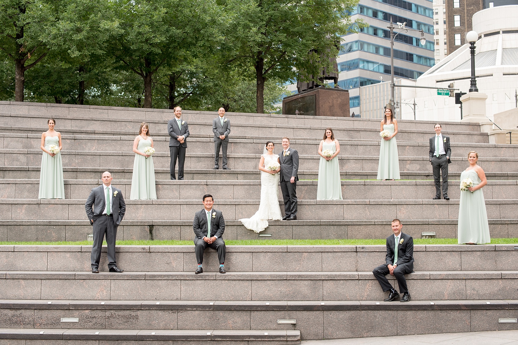 Mikkel Paige Photography photos of a wedding in downtown Chicago. A vogue photo of the wedding party with the bridesmaids in mint green gowns at Riverwalk. 