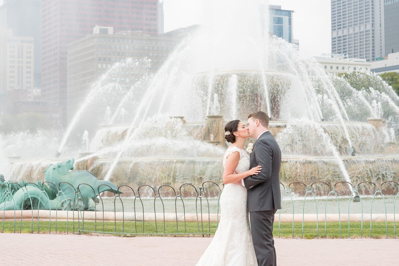 Mikkel Paige Photography photo of the bride and groom at Buckingham Fountain in downtown Chicago.