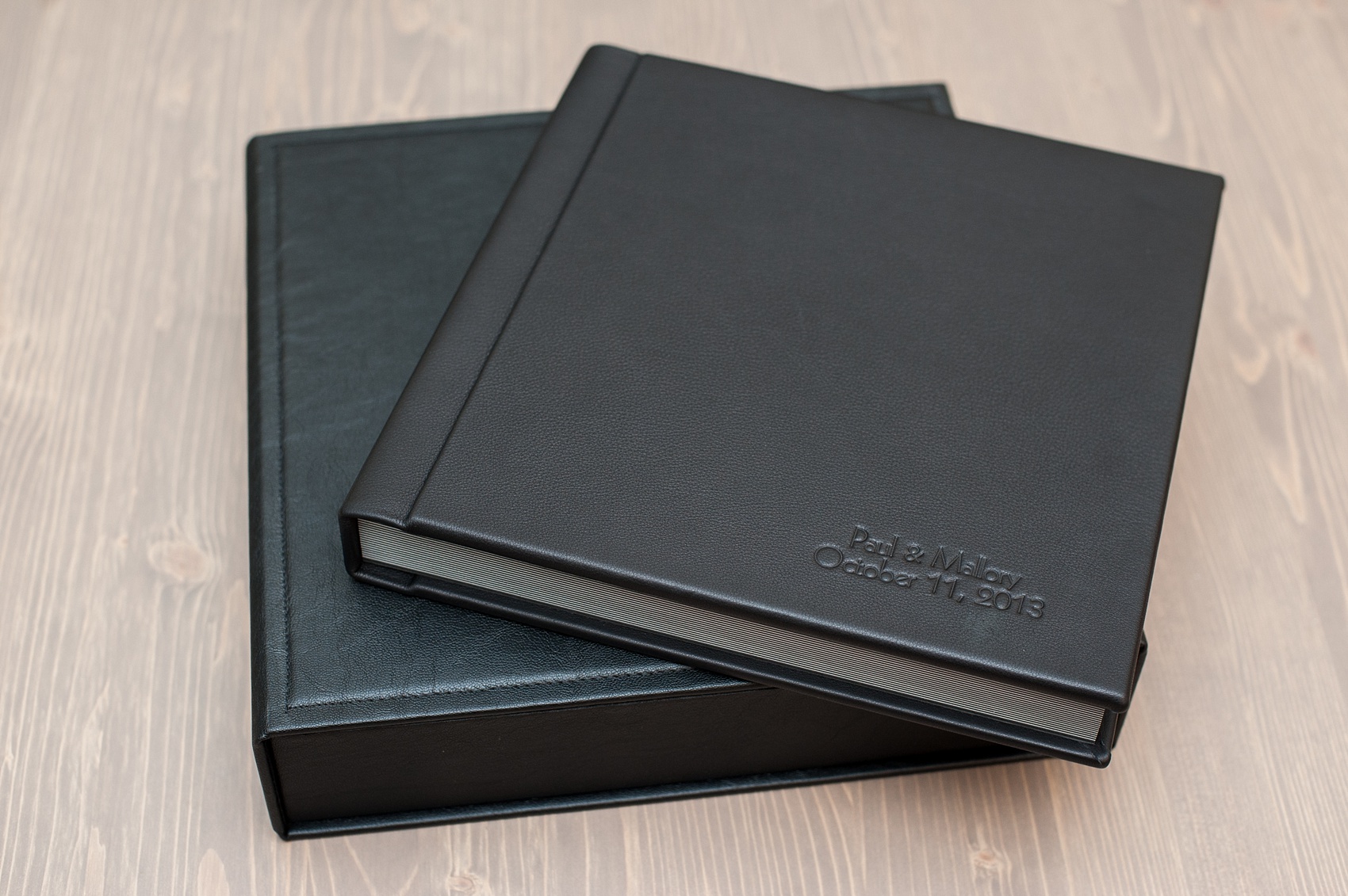 Mikkel Paige Photography black leather, fine-art wedding album option with cover debossing and sturdy box.