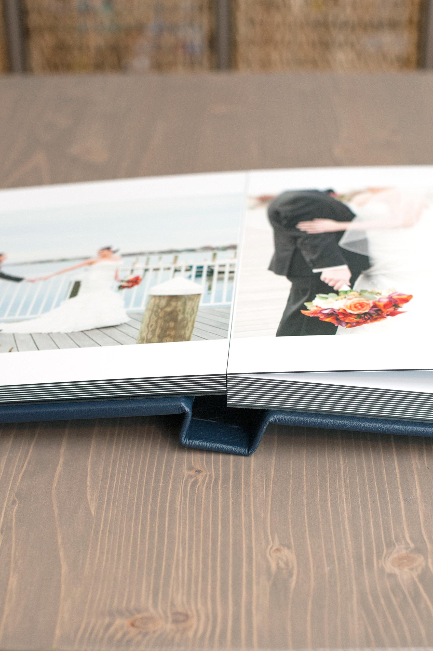 Mikkel Paige Photography photos of a fine art leather Madera wedding album in navy blue. 12x12" album for the bride and groom.