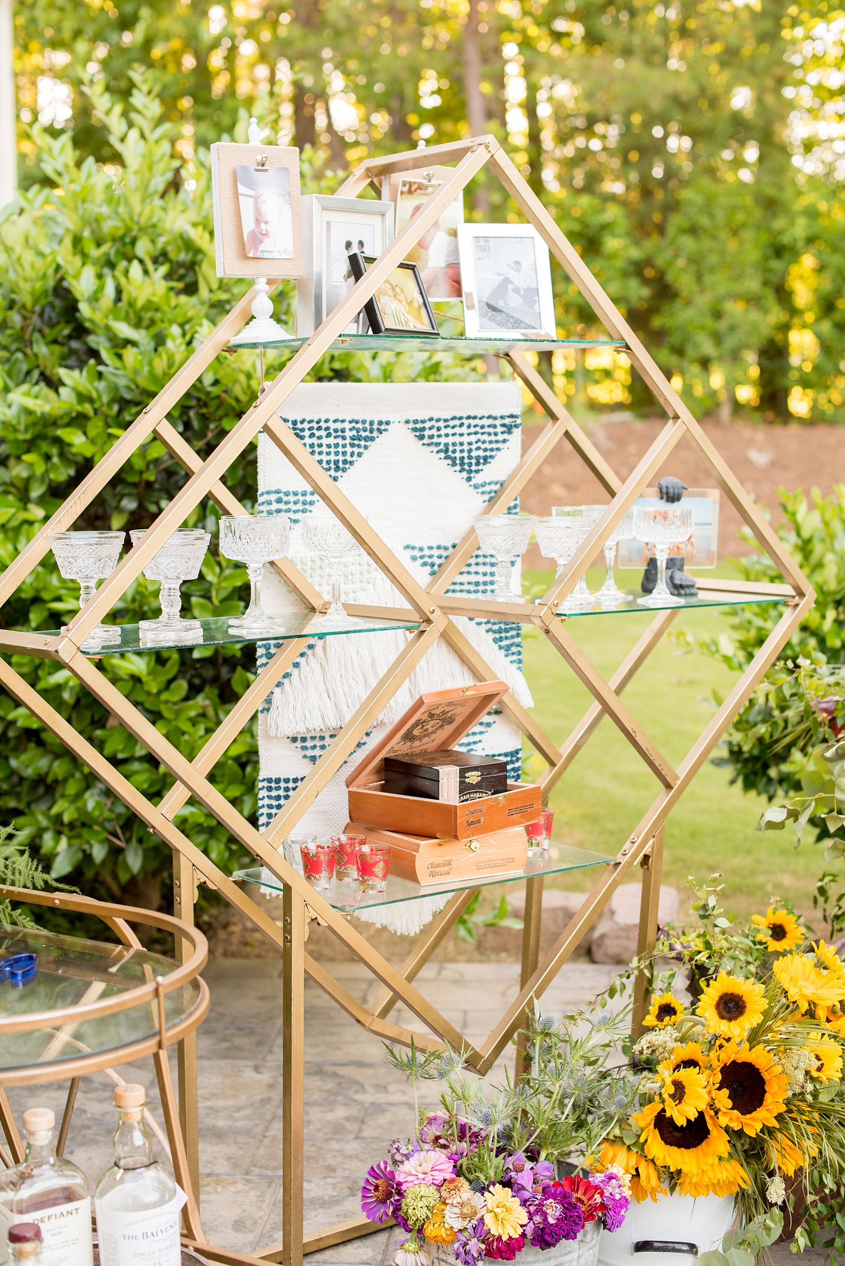 Mikkel Paige Photography photo of Moroccan themed party with a custom diamond gold cocktail shelf unit with cigar bar and macrame detail.