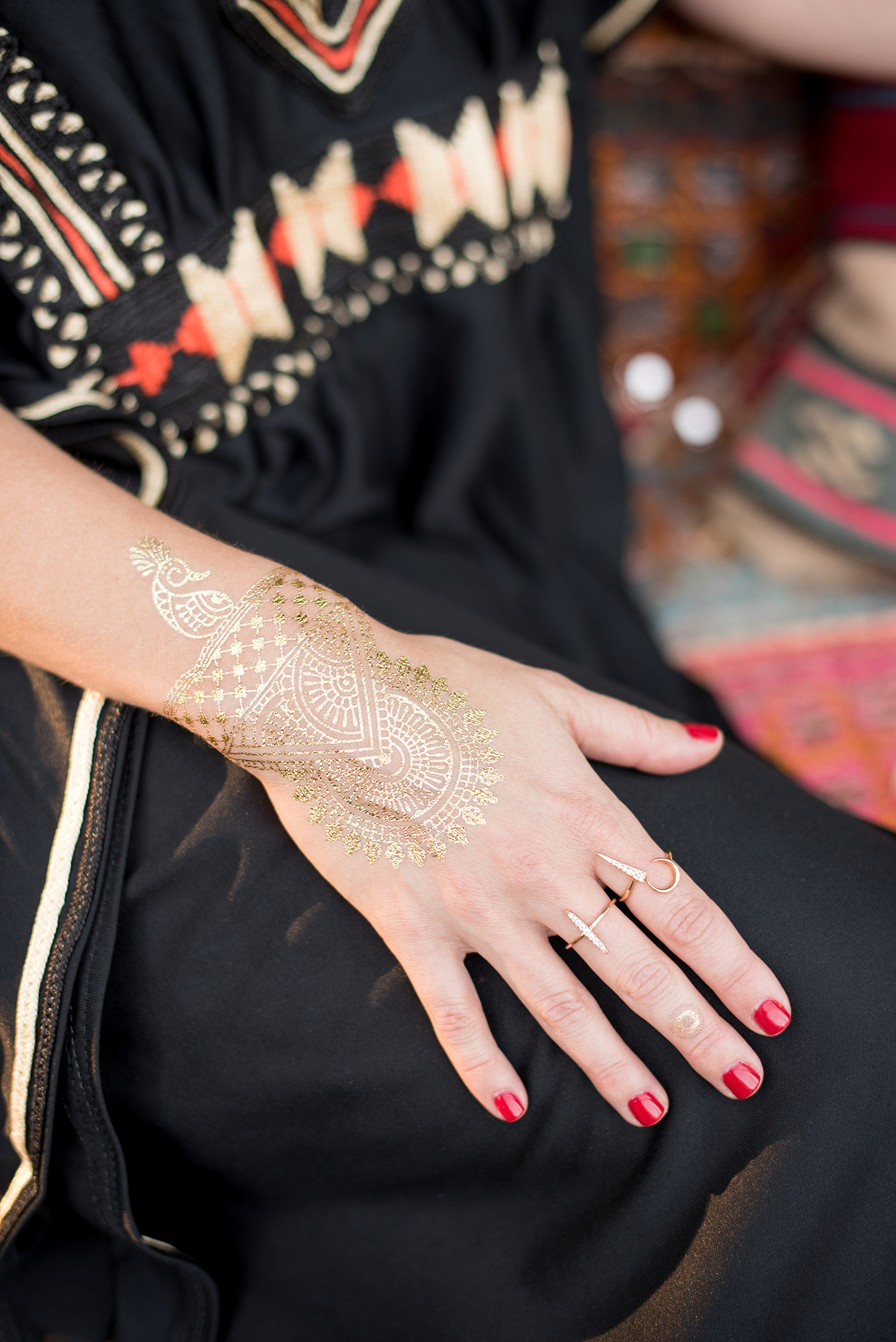 Mikkel Paige Photography photo of Moroccan themed party with gold flash-tat temporary tattoos.