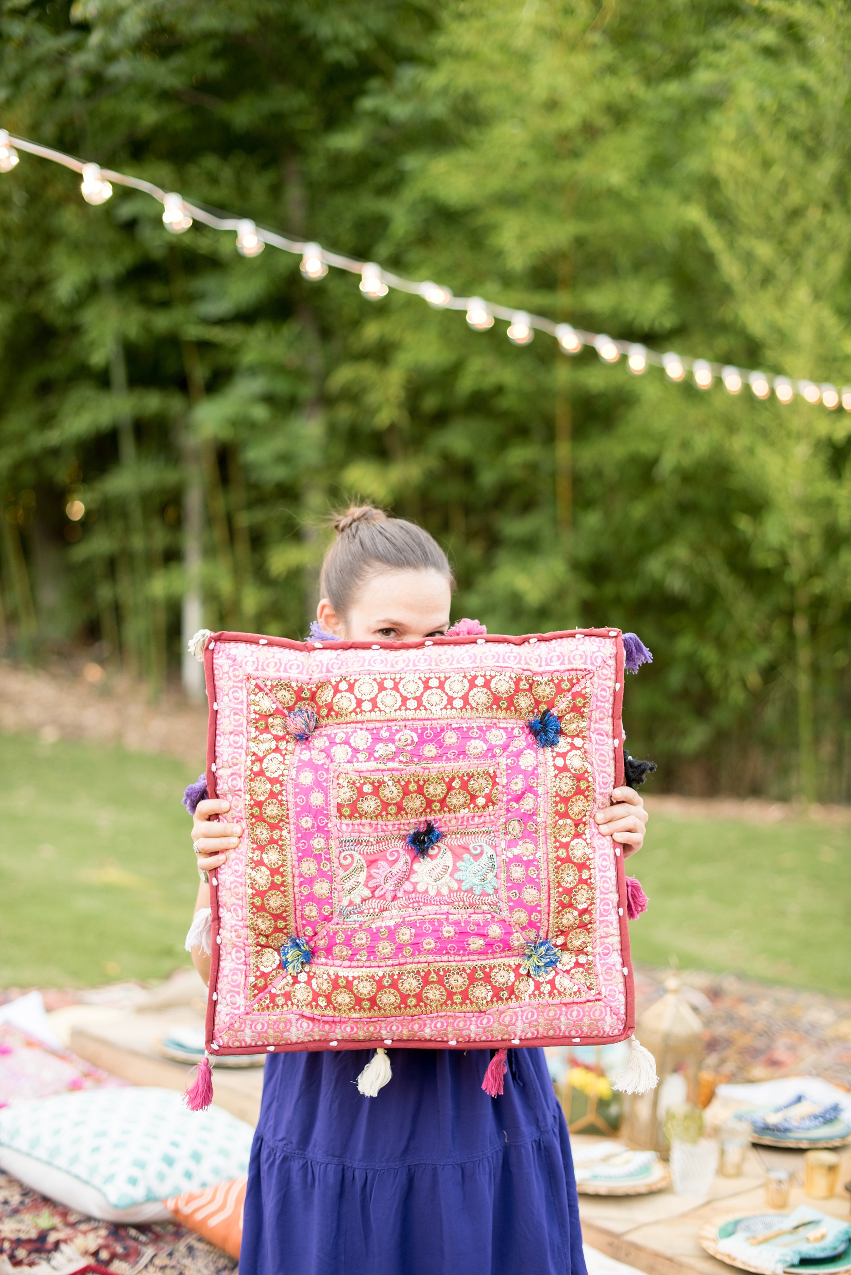 Mikkel Paige Photography photo of Morocco themed party with vintage furniture and festive, colorful Moroccan pillows.