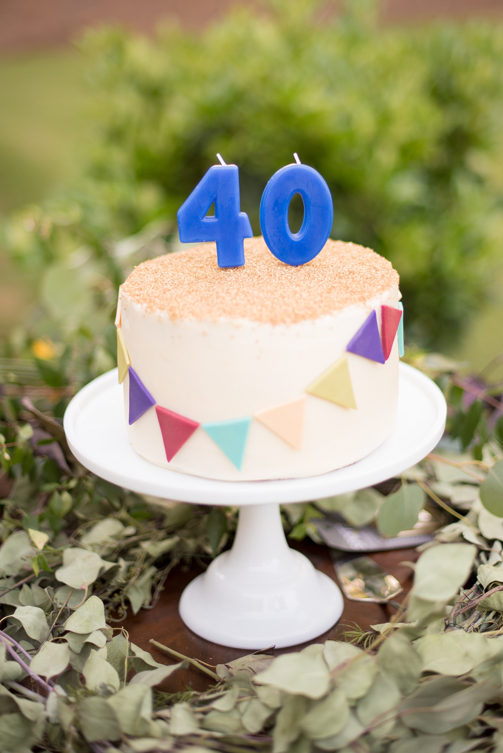 Mikkel Paige Photography photo of Moroccan themed surprise party and 40th birthday small buttercream and gold sugar crystals sprinkle cake.