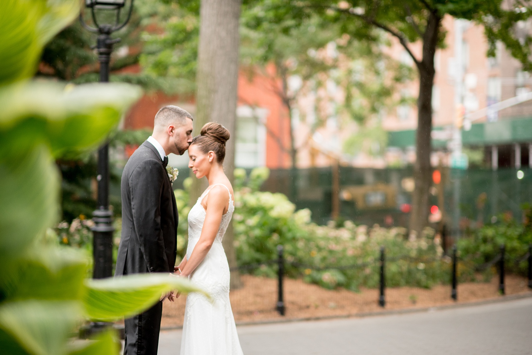 Mikkel Paige Photography captures a luxury wedding in NYC. First look photos in Washington Square Park with a classic bride and groom. Planning by Michelle Elaine Weddings.