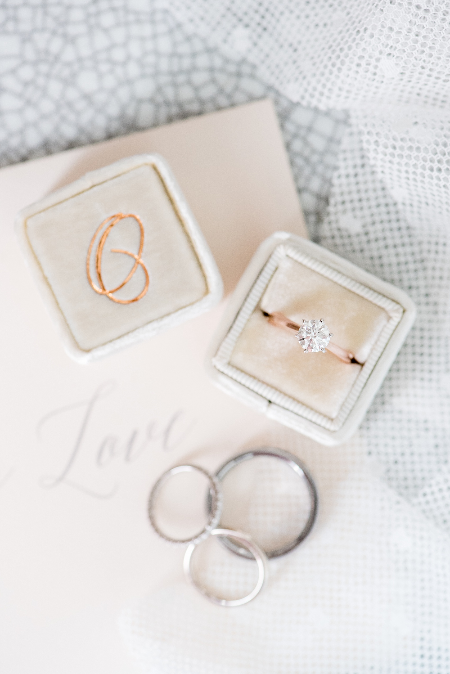 Mikkel Paige Photography captures a luxury wedding in NYC. Card with calligraphy for the bride and The Mrs. Box with a monogram "O" for her solitaire diamond engagement ring.